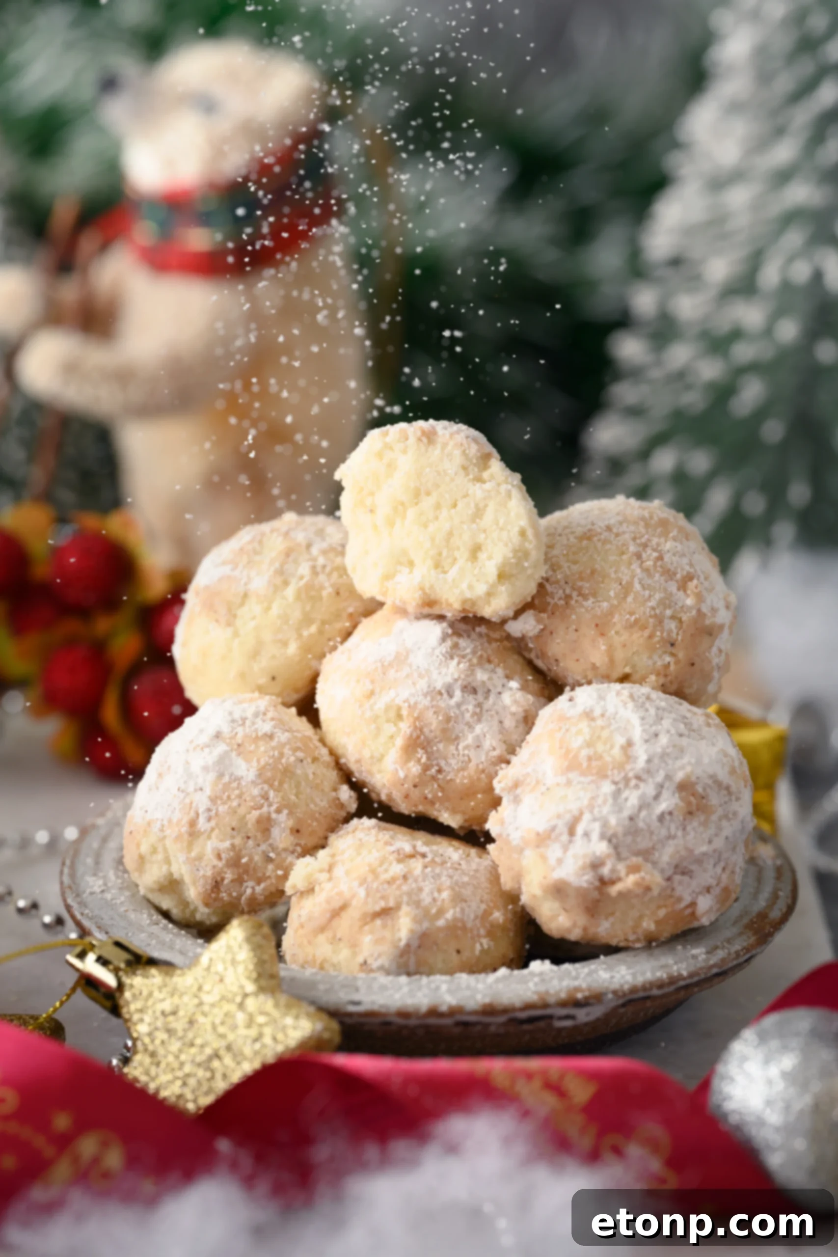 A close-up shot of several freshly baked Cinnamon Mexican Wedding Cookies, lightly dusted with powdered sugar and cinnamon, arranged on a rustic plate, evoking warmth and comfort.