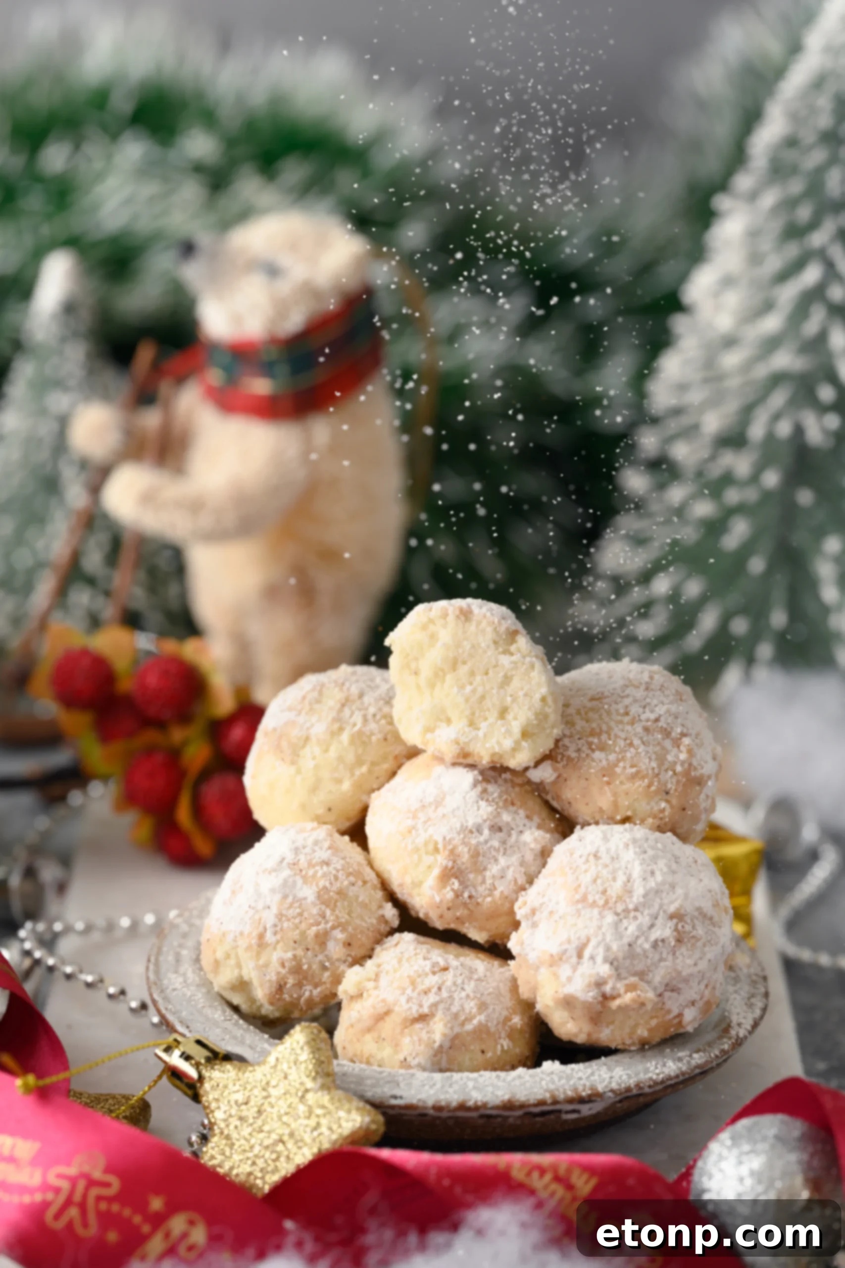 A close-up of a large bowl filled with freshly made Cinnamon Mexican Wedding Cookies, coated and ready to be served, highlighting their festive and delicious appearance.