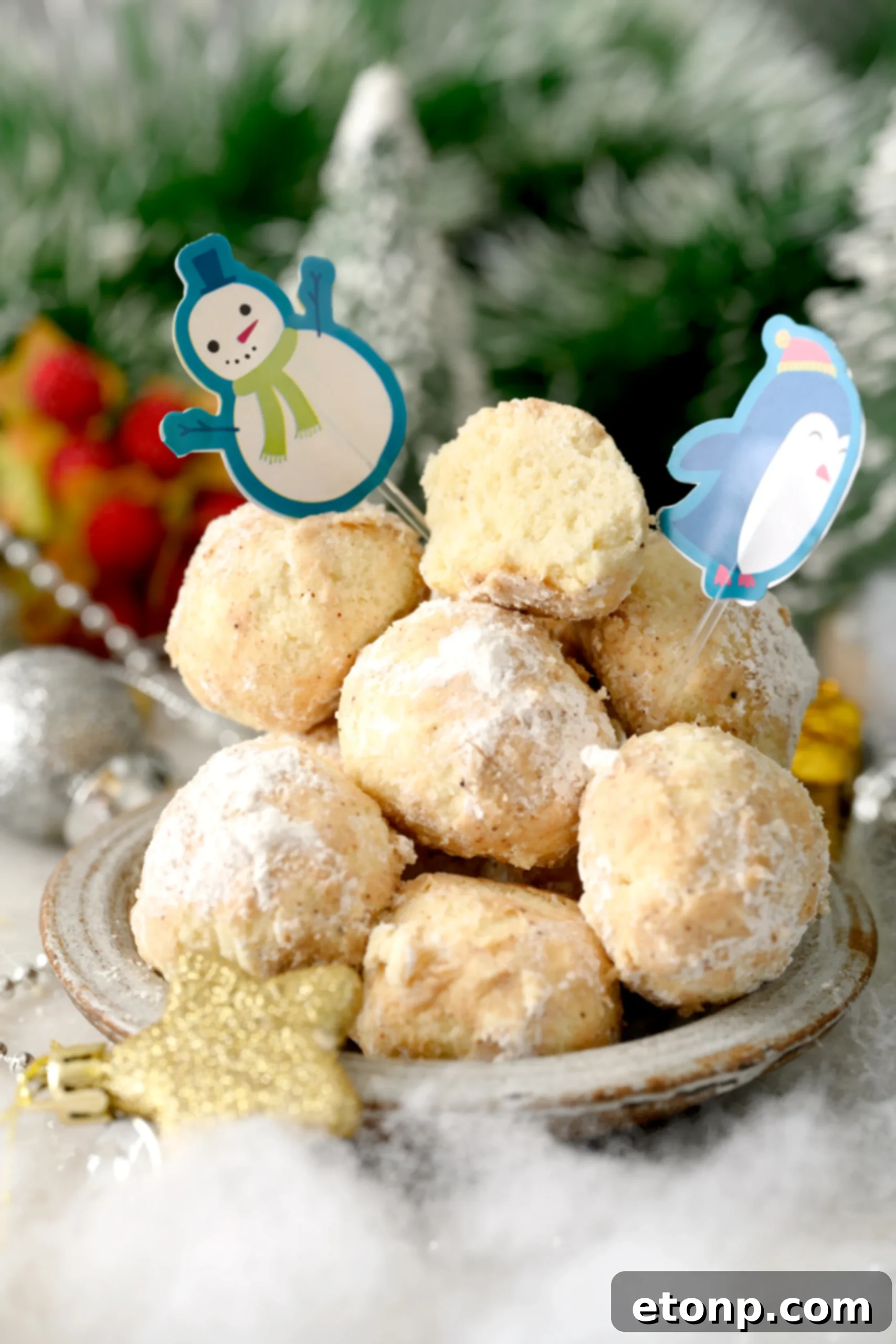 A selection of Cinnamon Mexican Wedding Cookies carefully placed on a cooling rack, allowing them to fully set after being baked and dusted, highlighting their delicate form.