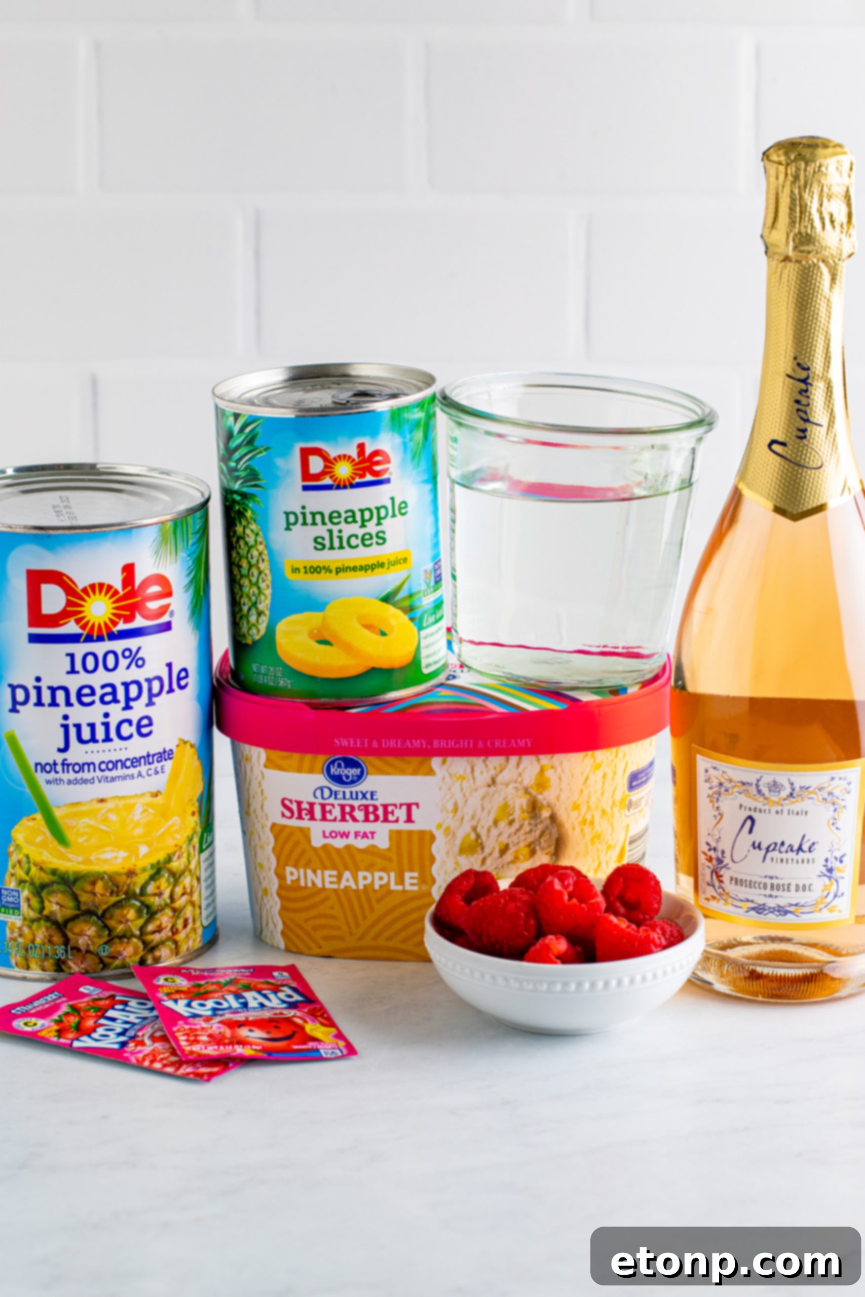 Delicious Boozy Sherbet Punch being poured into a glass, showcasing its vibrant color