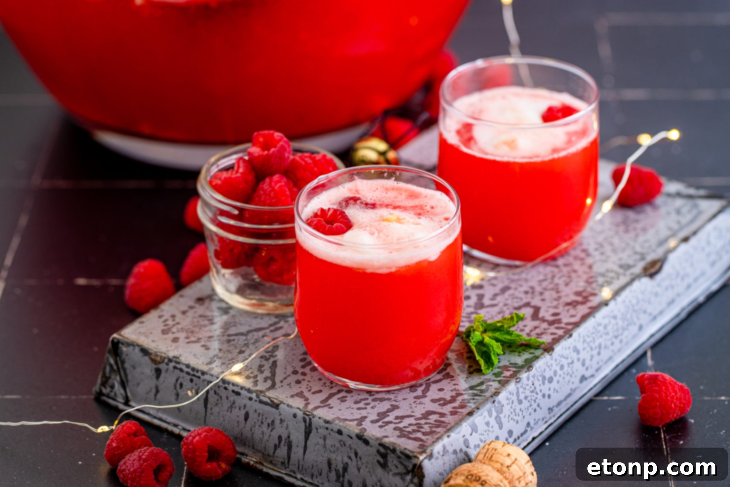 Close up of Boozy Sherbet Punch with melting sherbet in a decorative glass