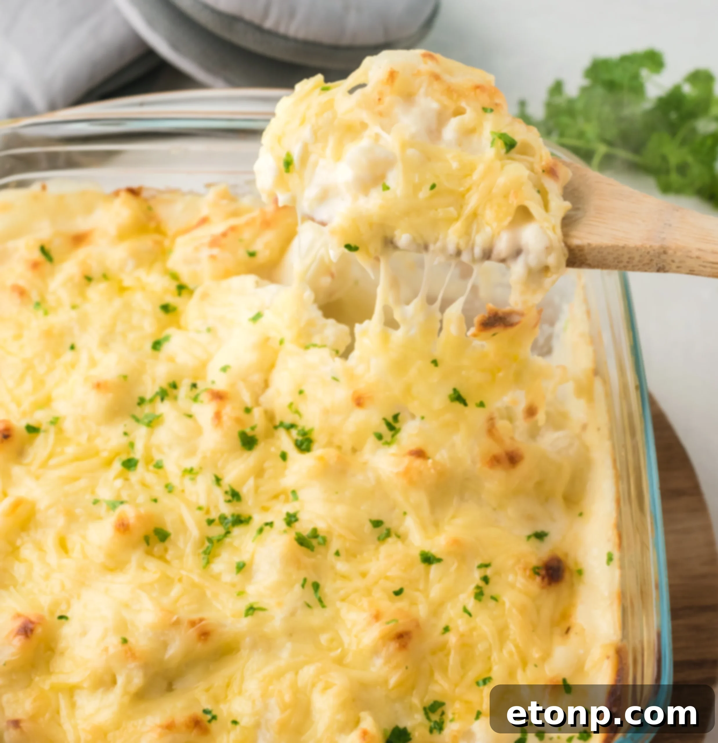 Serving Cheesy Cauliflower Casserole