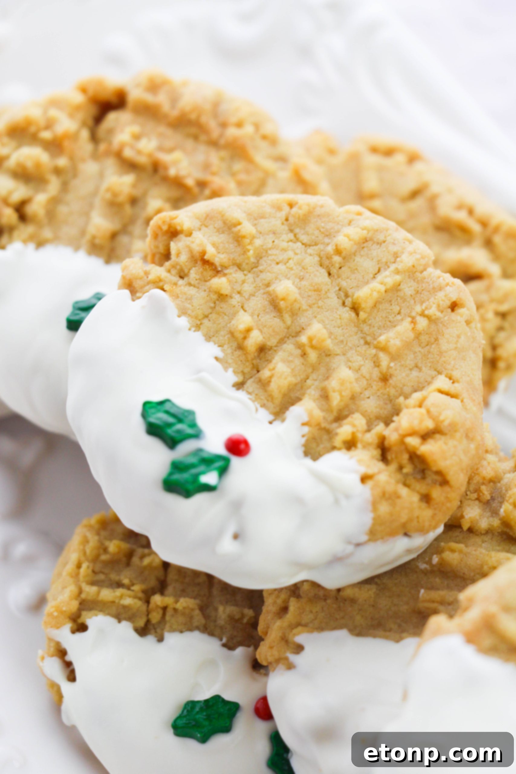 Silky White Chocolate Peanut Butter Cookies 5 Half-dipped white chocolate peanut butter cookie with a clear view of the texture