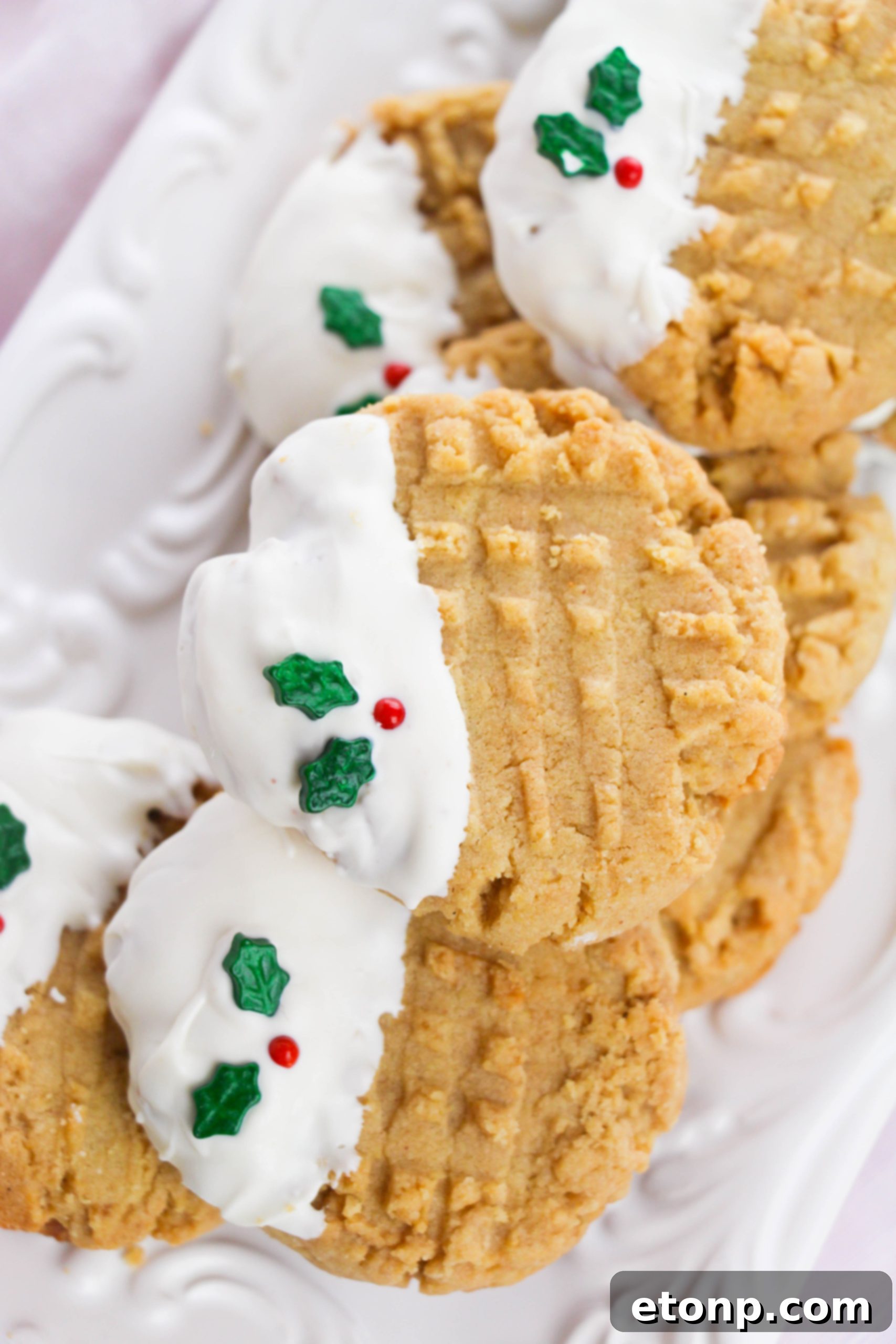 Silky White Chocolate Peanut Butter Cookies 8 Undipped peanut butter cookies displaying the classic fork pattern
