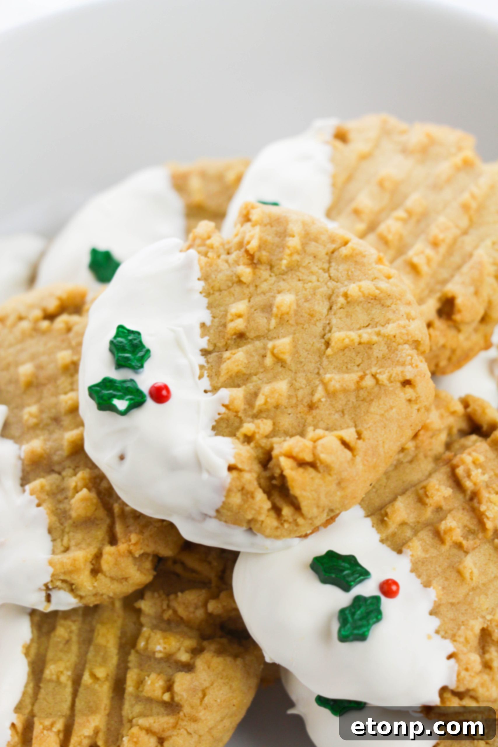 Silky White Chocolate Peanut Butter Cookies 9 Collection of white chocolate dipped peanut butter cookies on a table