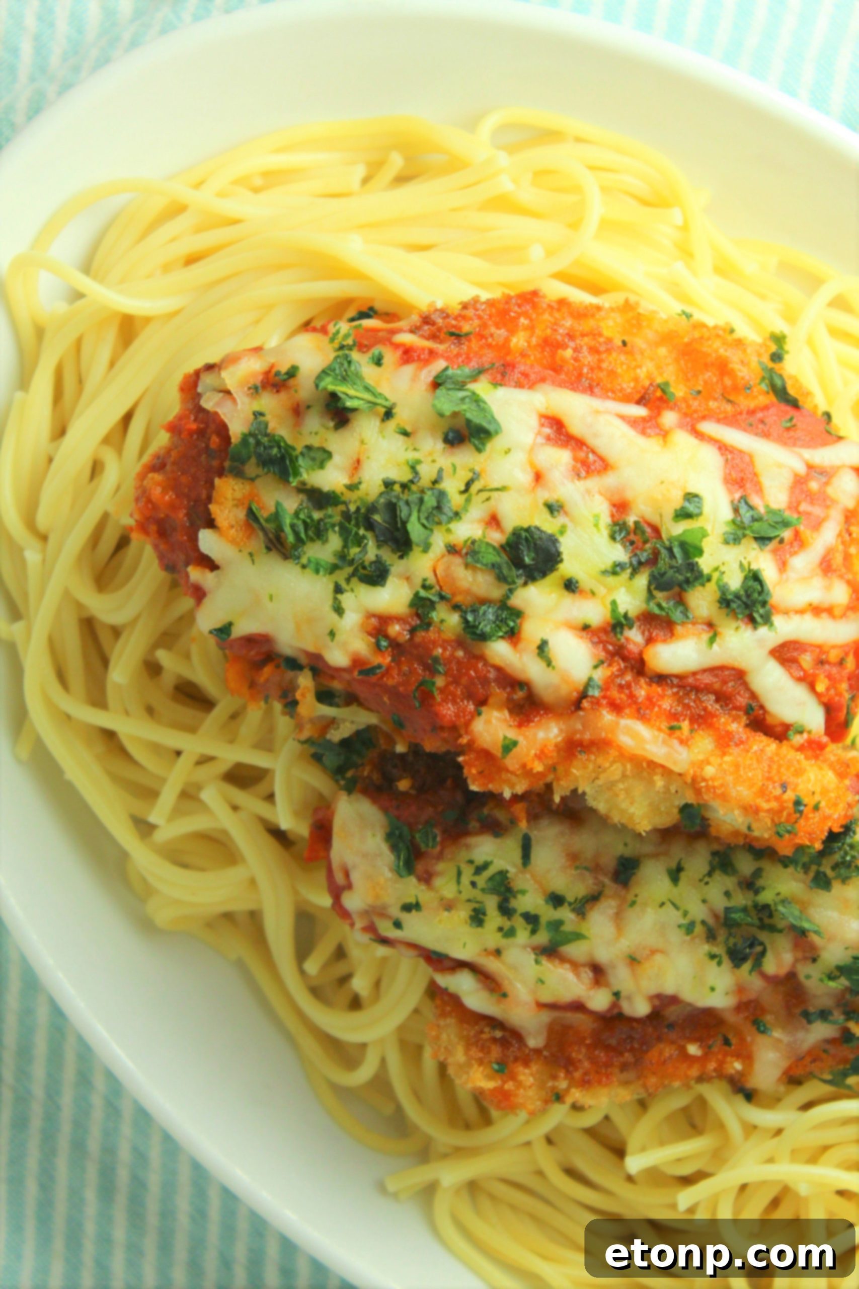 Crispy, Cheesy Chicken Parmesan 12 Plated Chicken Parmesan ready to be served