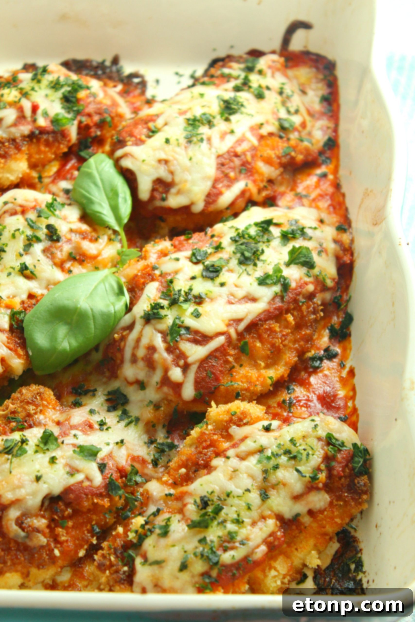 Crispy, Cheesy Chicken Parmesan 7 Thinly sliced chicken breasts on a cutting board