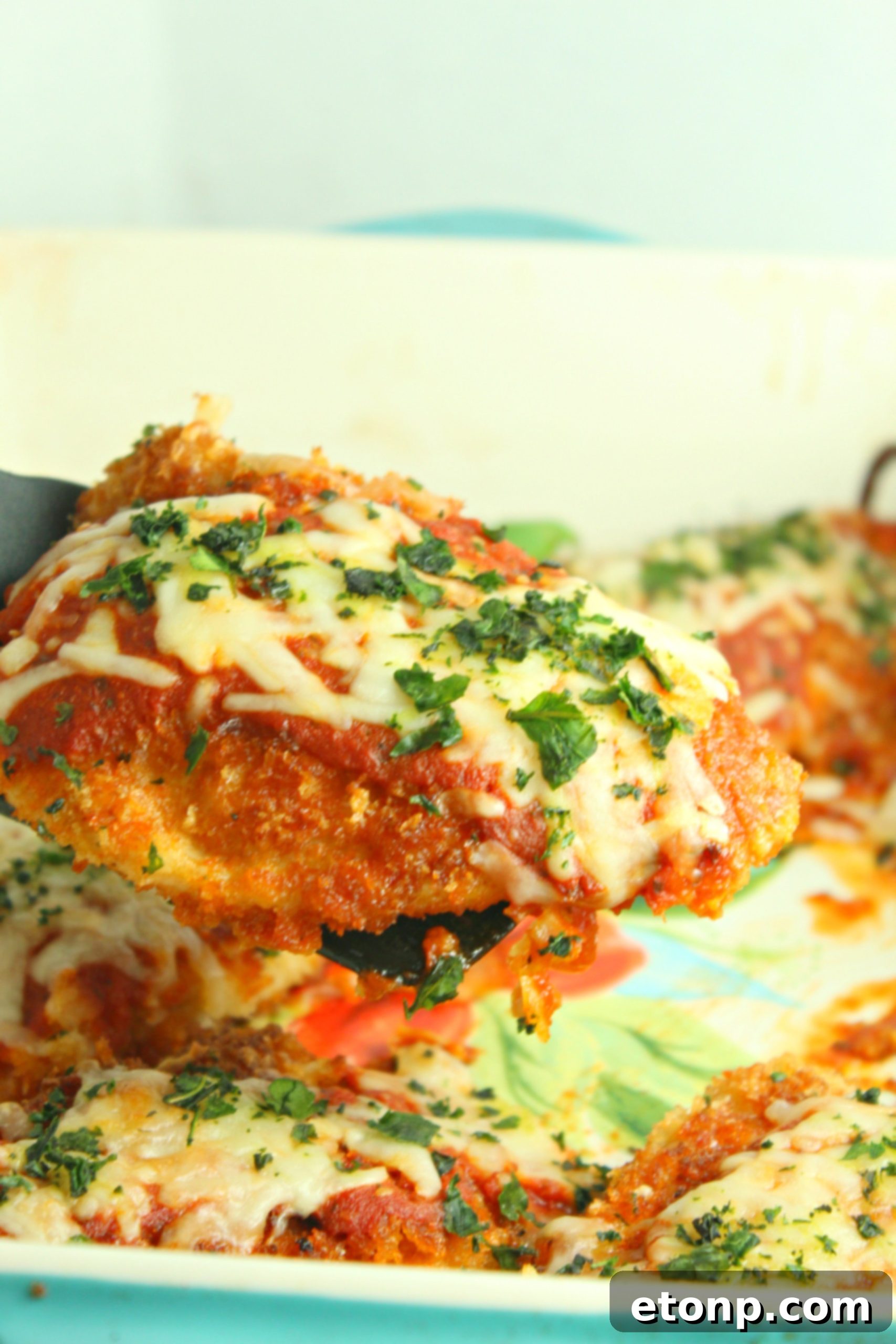 Crispy, Cheesy Chicken Parmesan 8 Fresh garlic cloves being minced