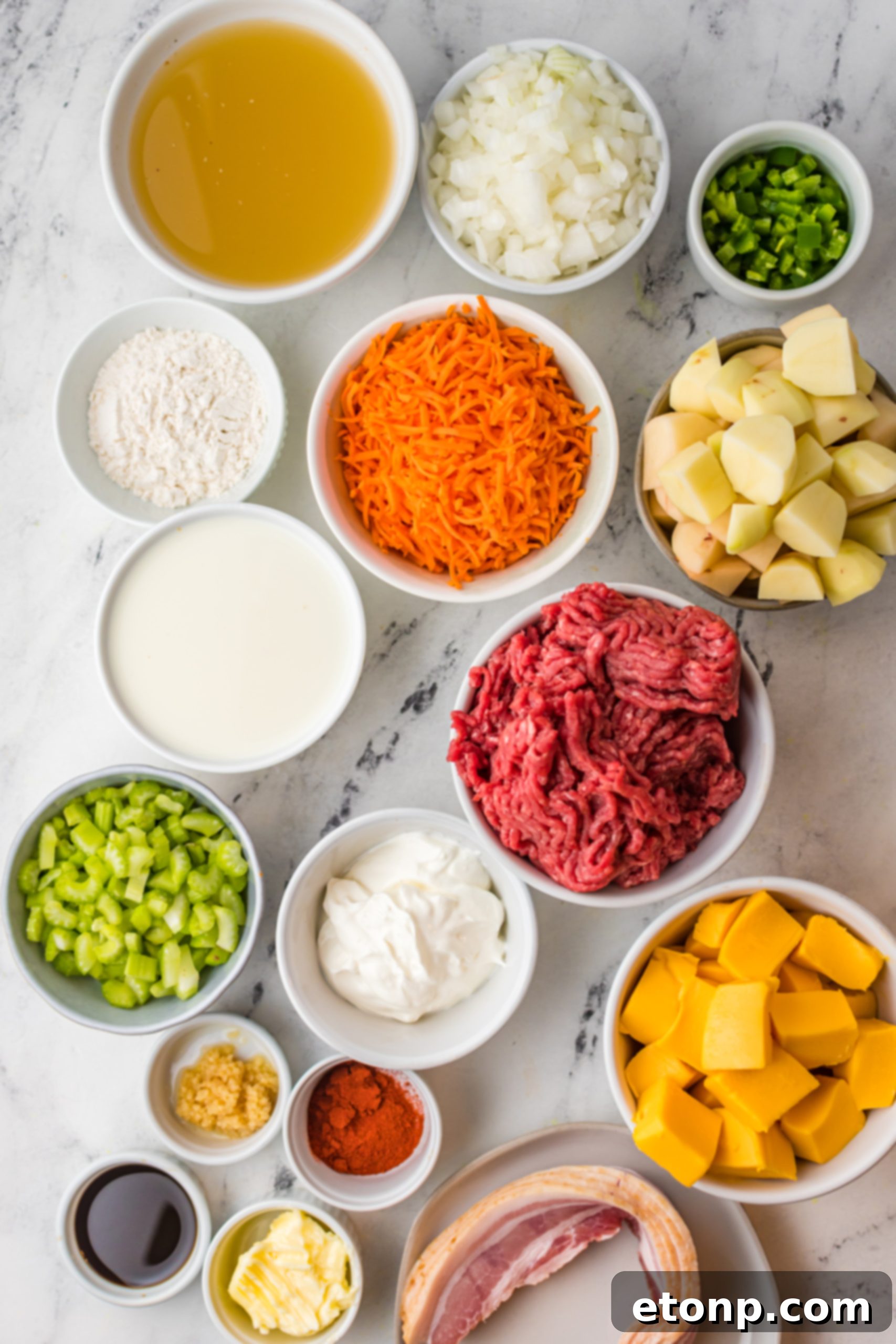 Overhead shot of slow cooker cheeseburger soup in a rustic bowl with a spoon, showing its creamy texture and rich ingredients.