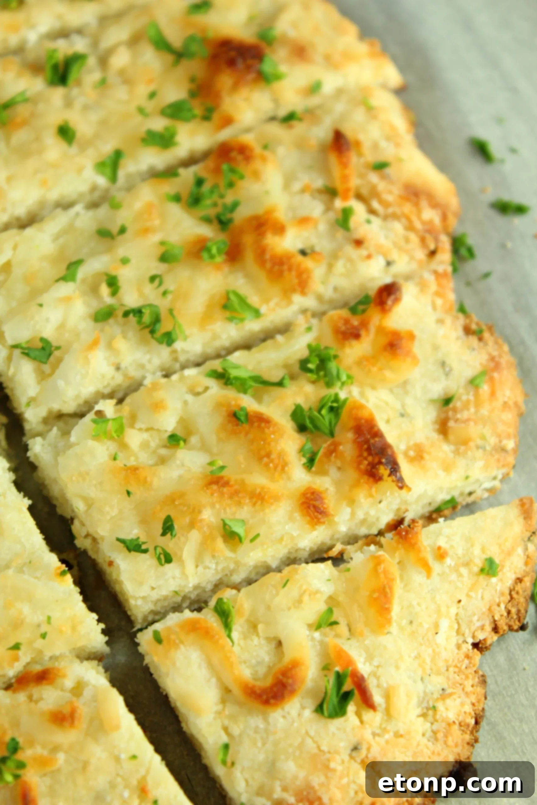 Four Cheese Keto Breadsticks Deliciously Low Carb 2 Delicious Four Cheese Keto Breadsticks arranged on a plate, ready to be served as a low-carb snack or appetizer.