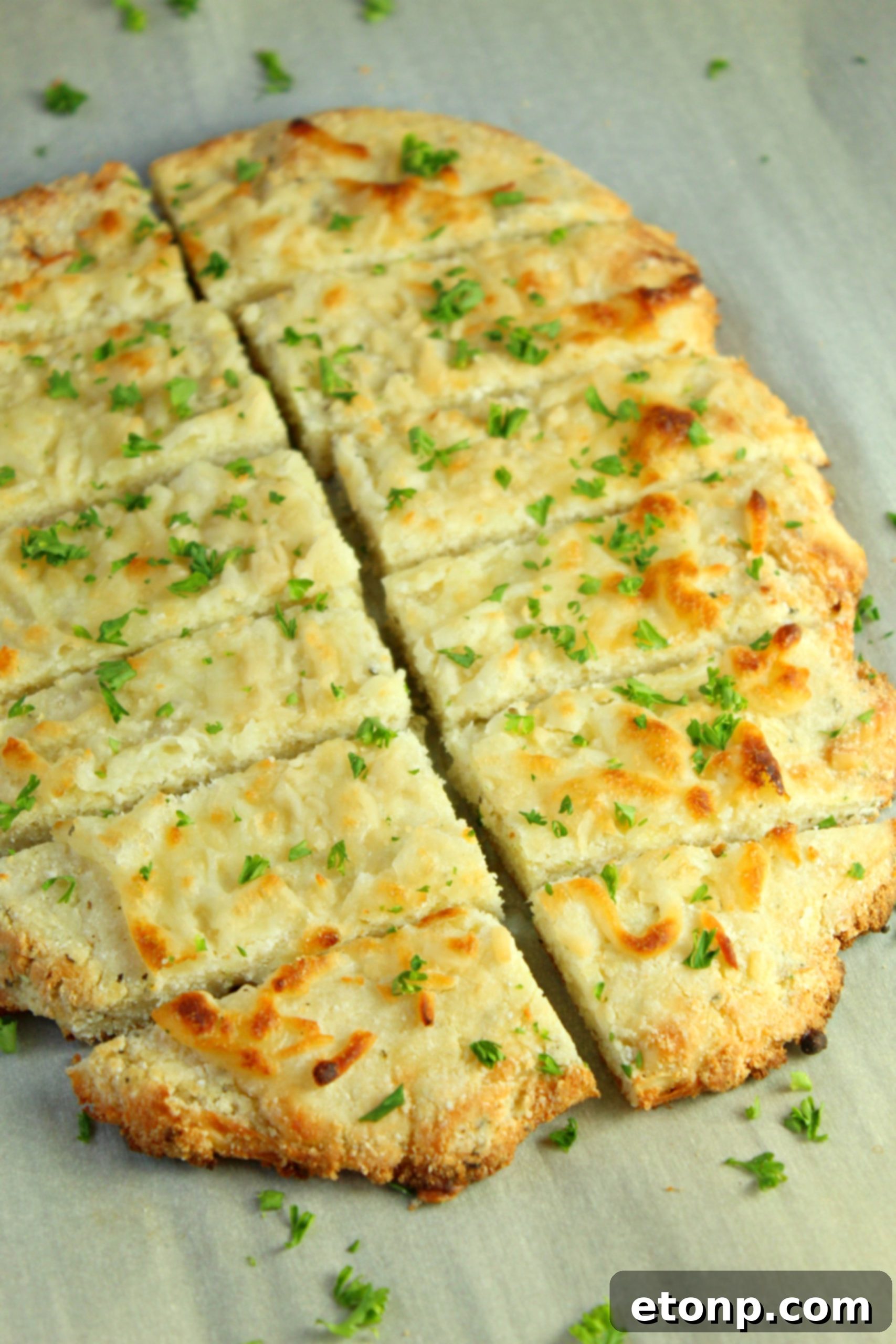 Four Cheese Keto Breadsticks Deliciously Low Carb 12 Four Cheese Keto Breadsticks with a side of dipping sauce, showcasing a complete serving suggestion.