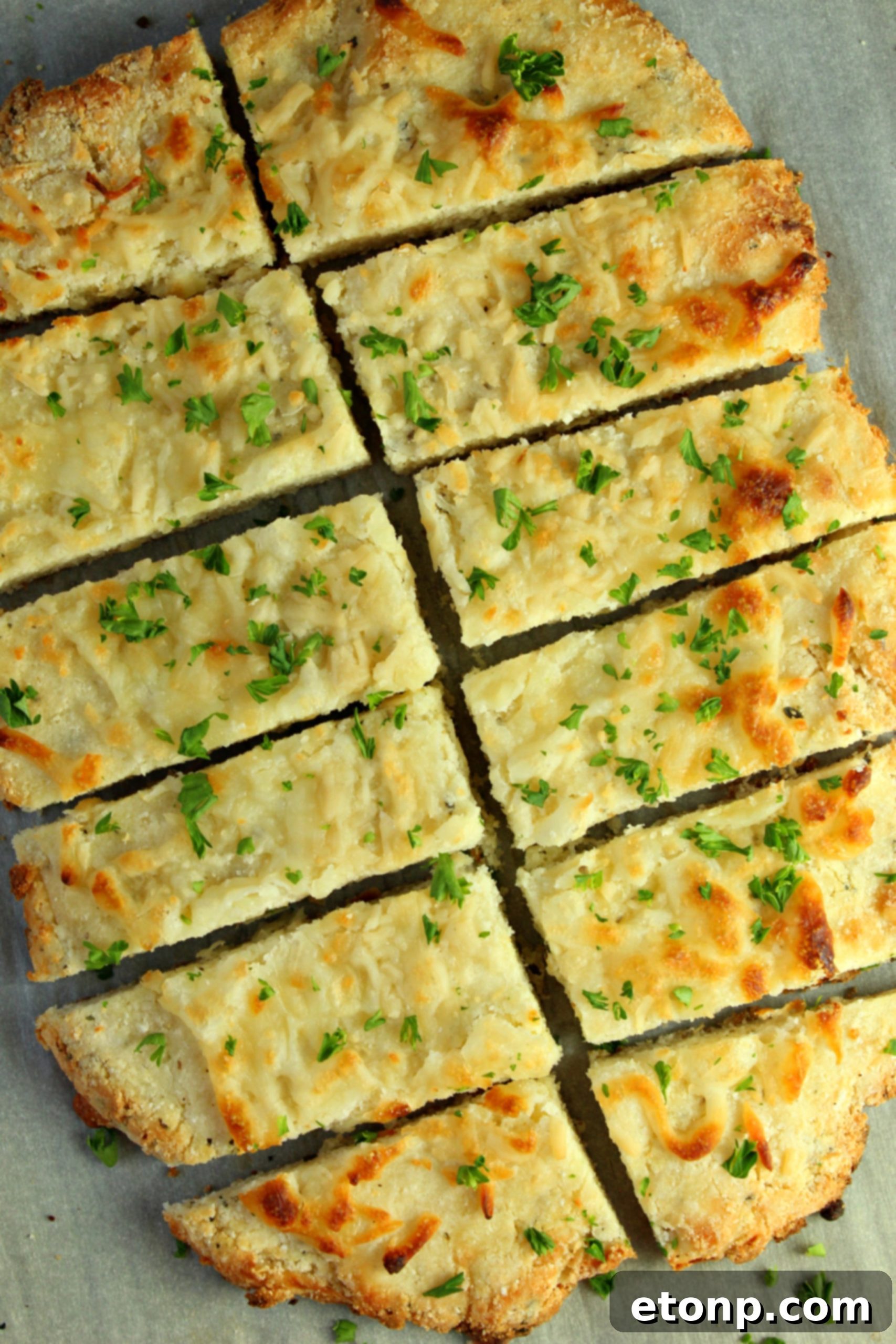 Four Cheese Keto Breadsticks Deliciously Low Carb 3 Close-up of golden brown Four Cheese Keto Breadsticks, showcasing their cheesy texture and crispy edges.