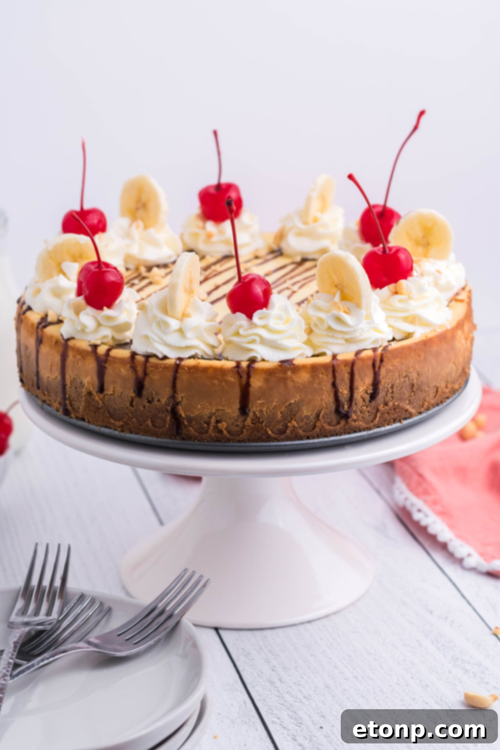 A packet of banana cream pudding mix alongside a bowl of softened cream cheese, highlighting key ingredients for the banana-flavored cheesecake filling.