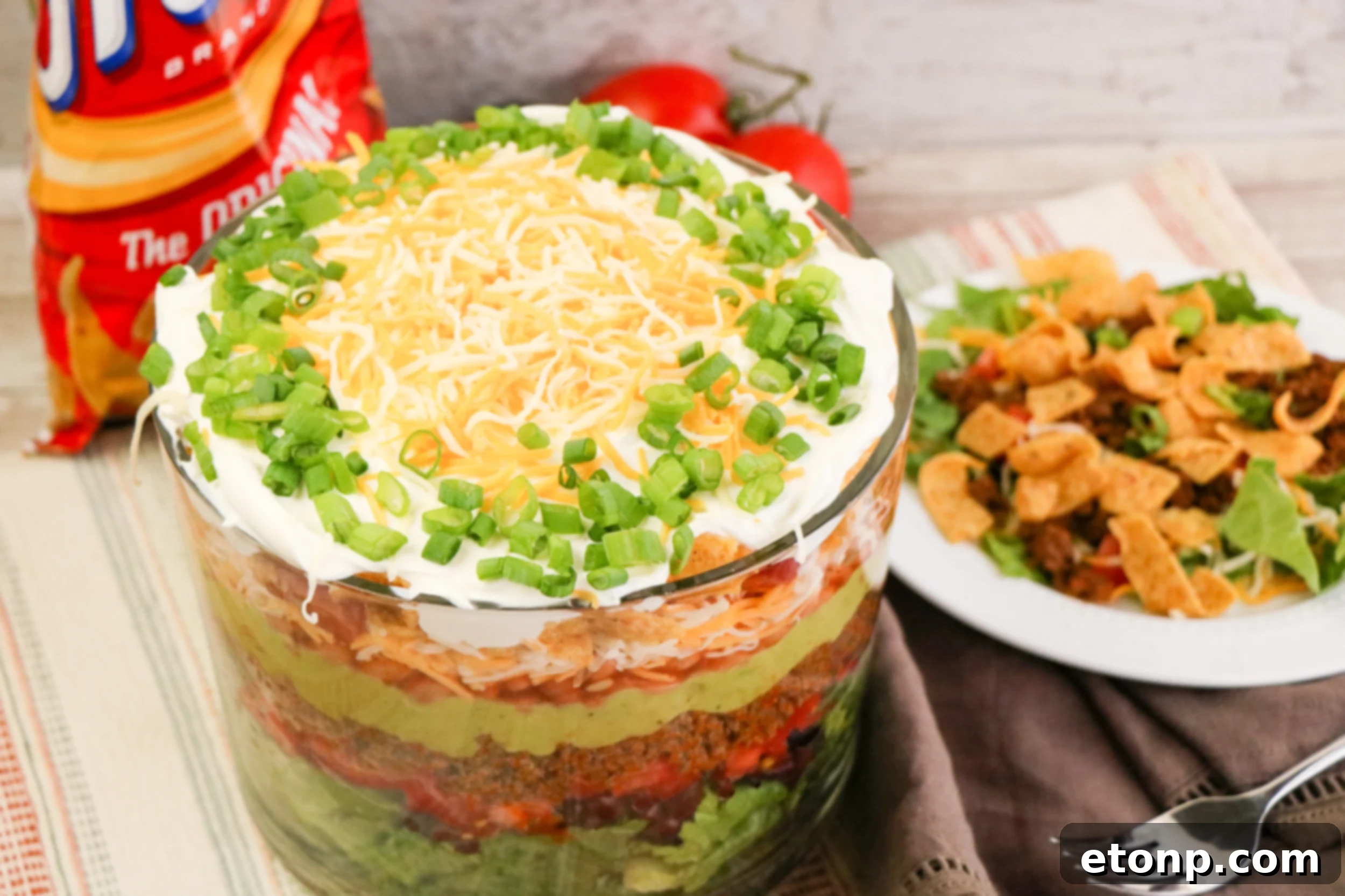 Delicious Taco Salad Trifle in a glass bowl
