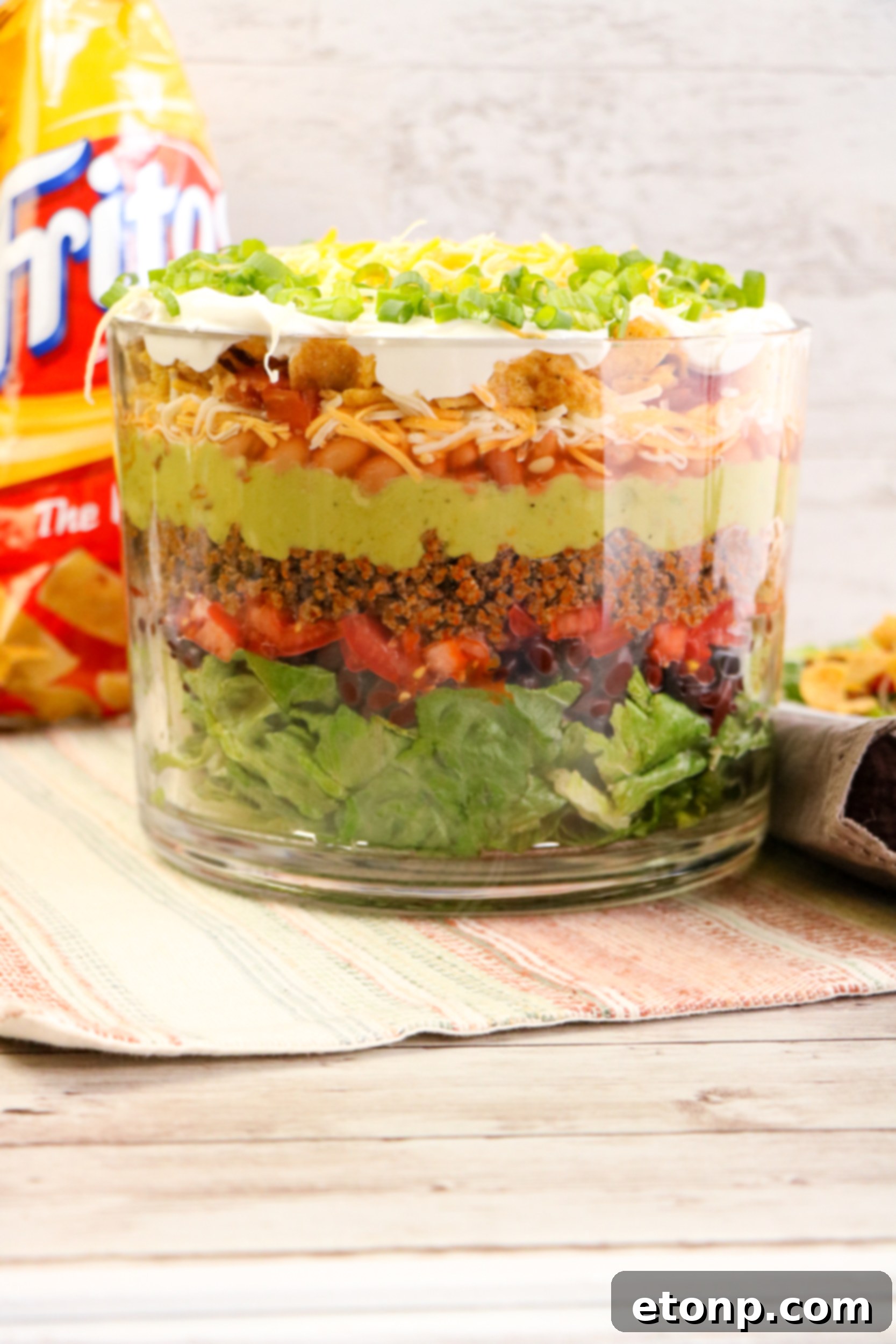 Full view of a stunning Taco Salad Trifle in a decorative glass dish