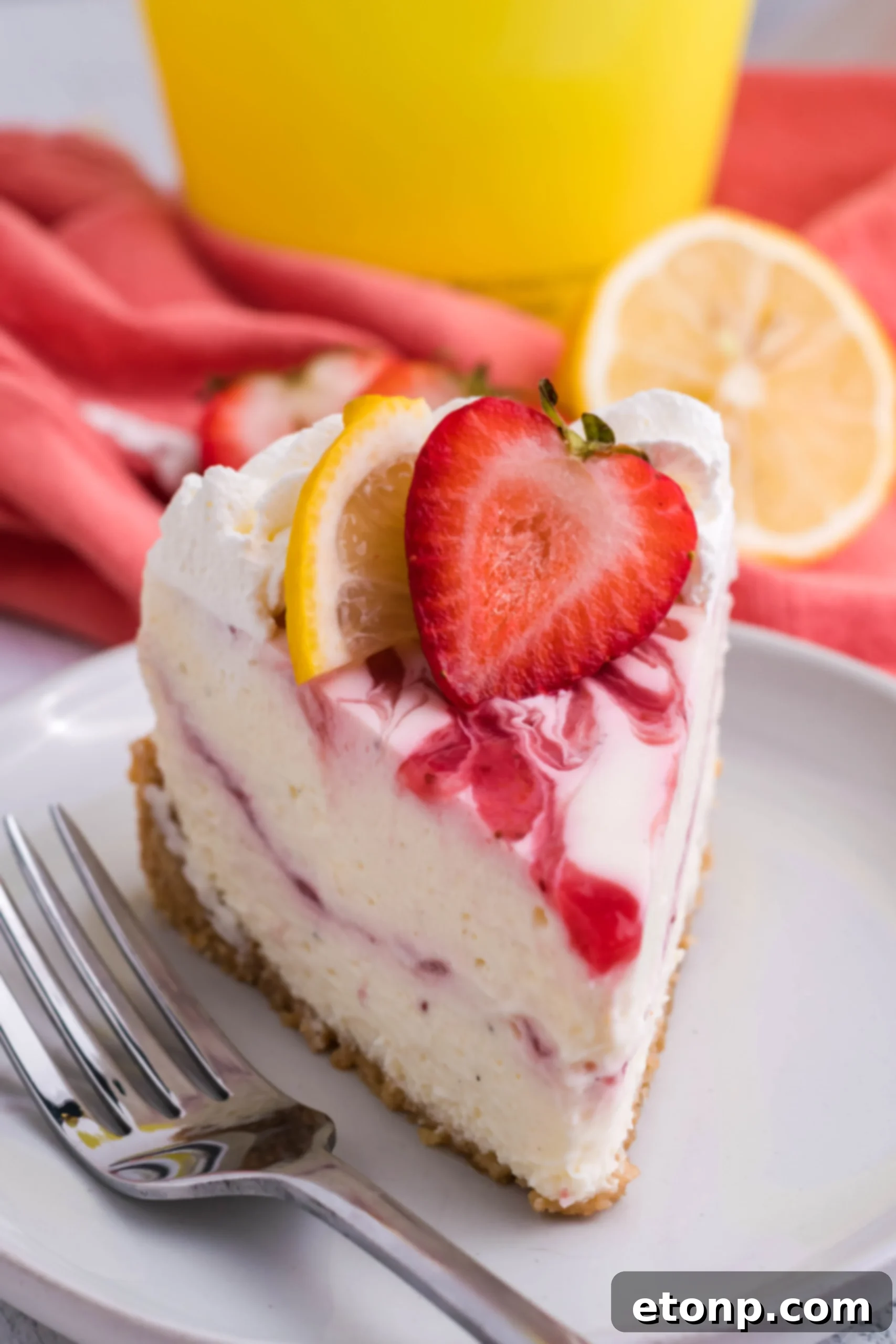 A delectable close-up shot of a single slice of Strawberry Lemon RumChata Cheesecake on a pristine white plate, beautifully showcasing the layered crust, rich filling, and alluring strawberry topping.