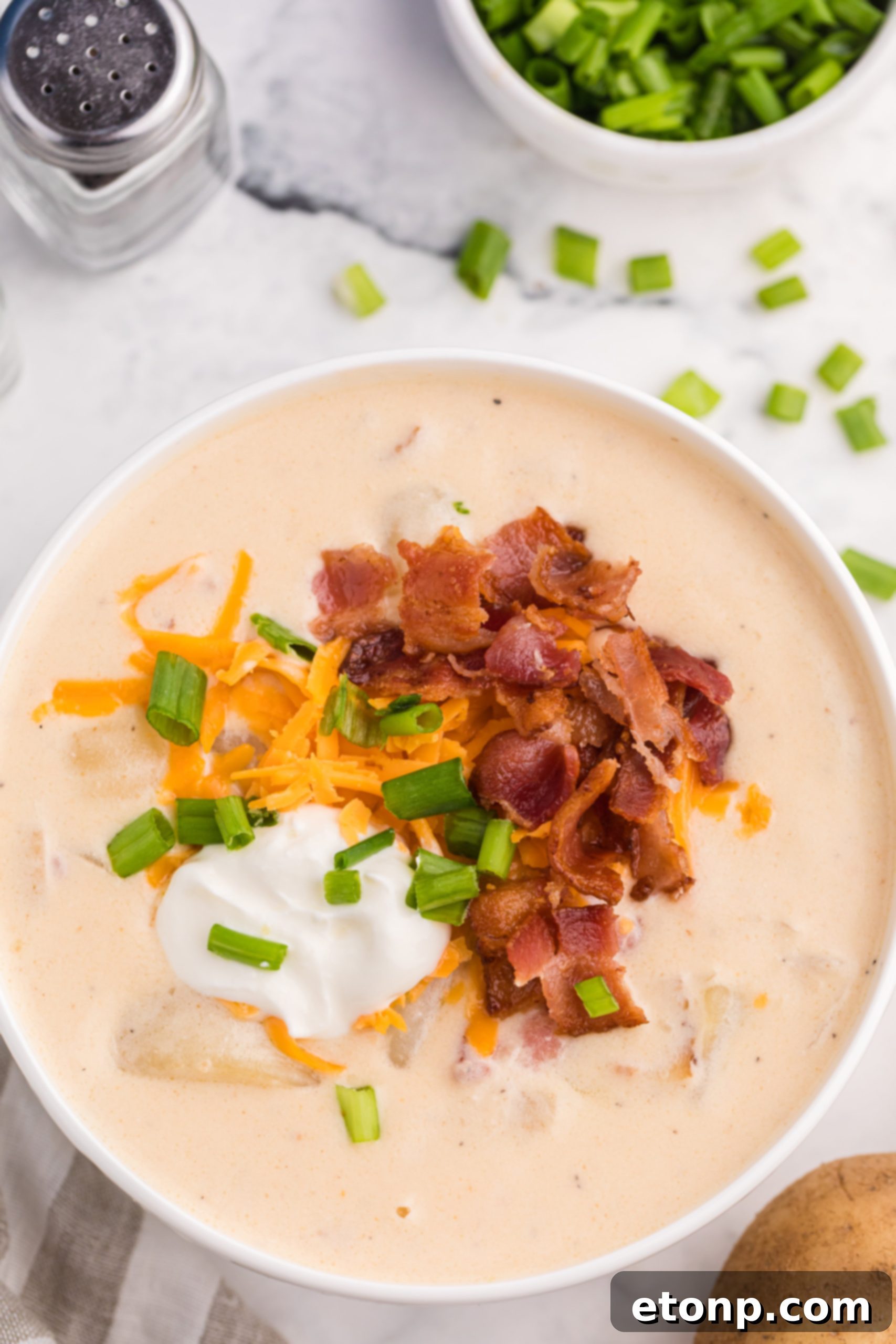 Loaded Baked Potato Soup being served