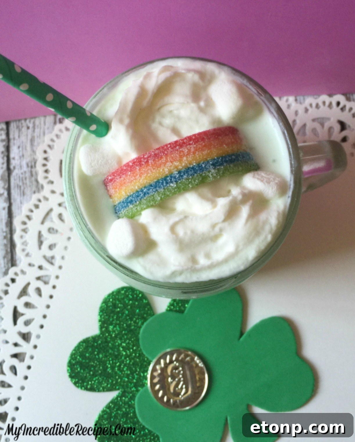 Shamrock Cocoa served cold in a tall glass, with whipped cream and sprinkles