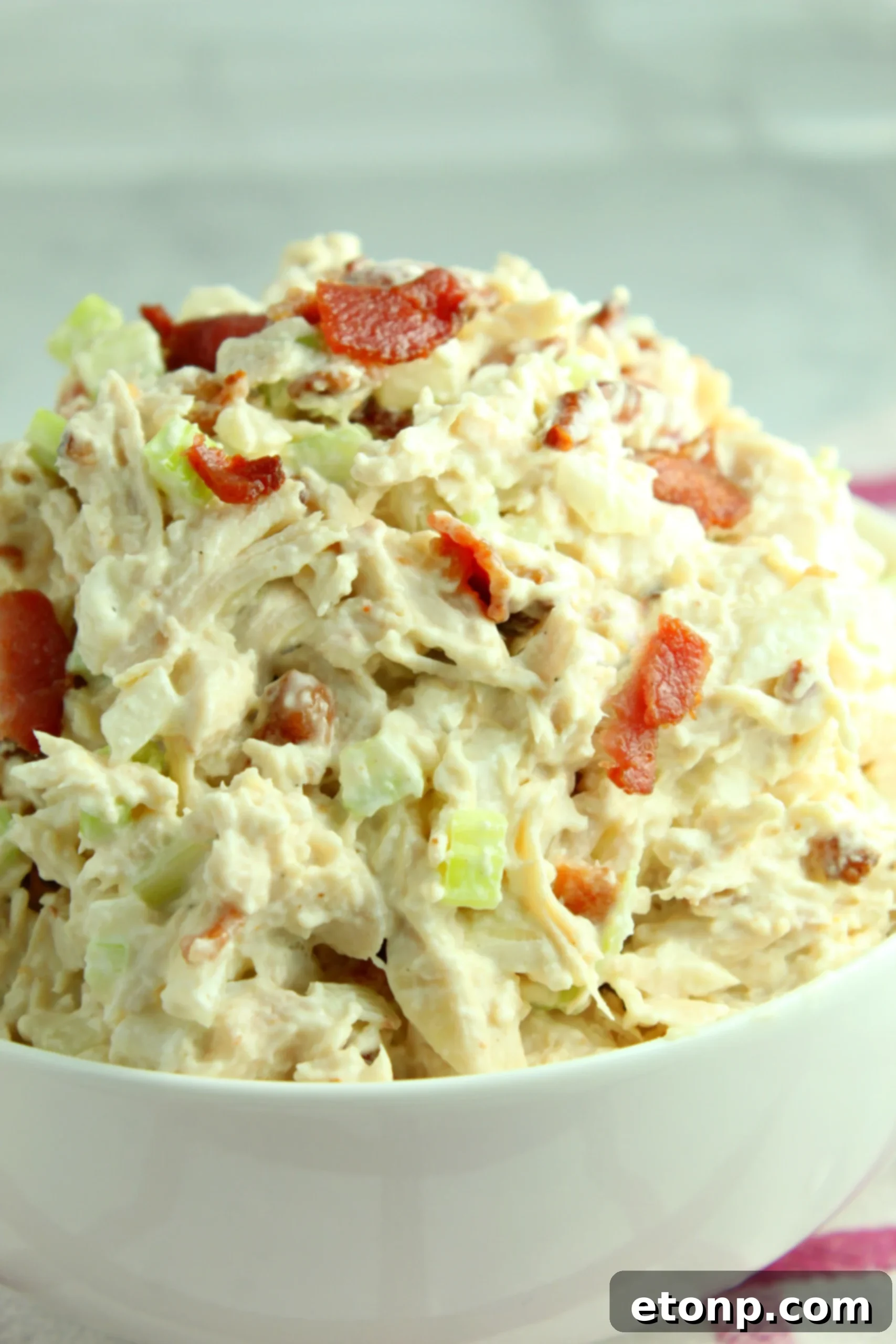 Creamy homemade Willow Tree Chicken Salad with bacon, served in a bowl.