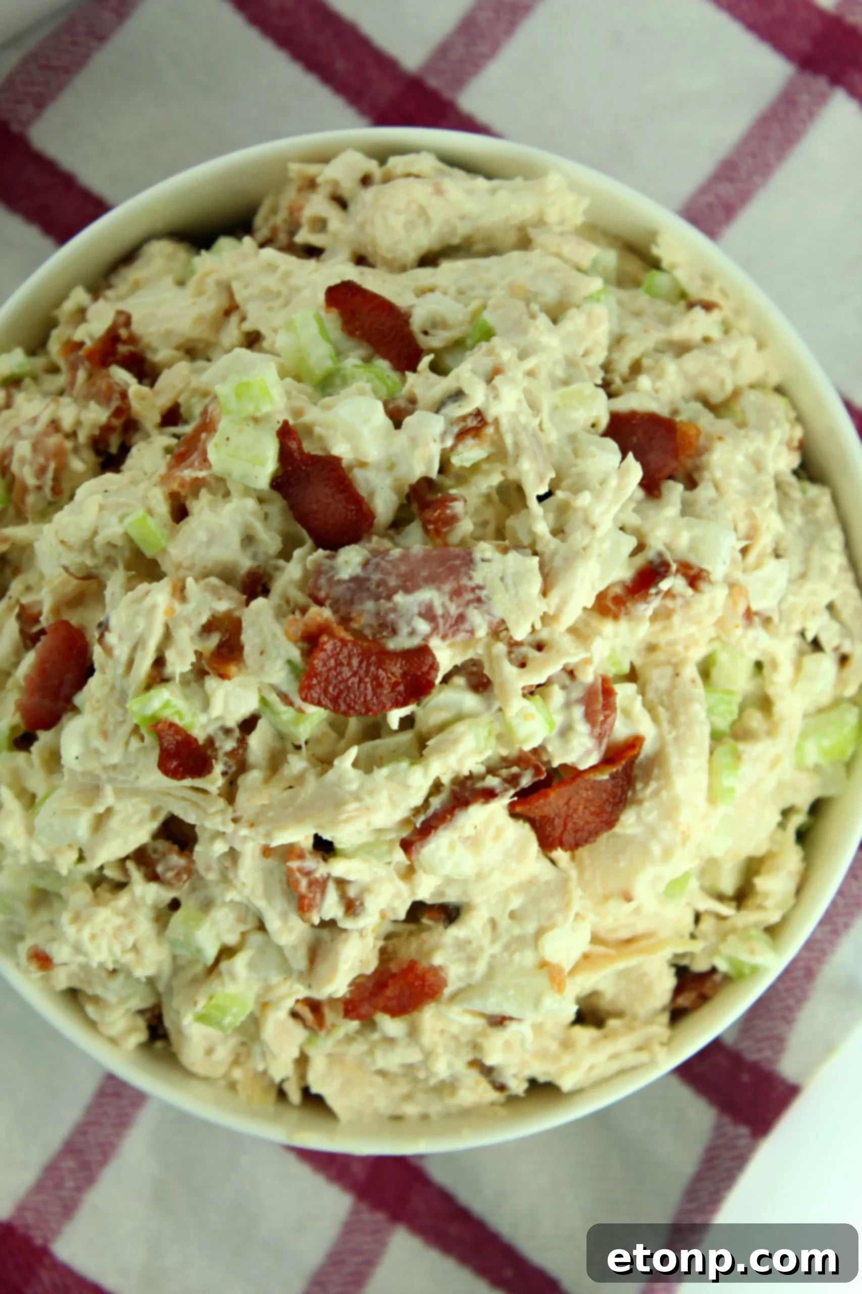 Close-up of Willow Tree Chicken Salad with bacon on a sandwich.