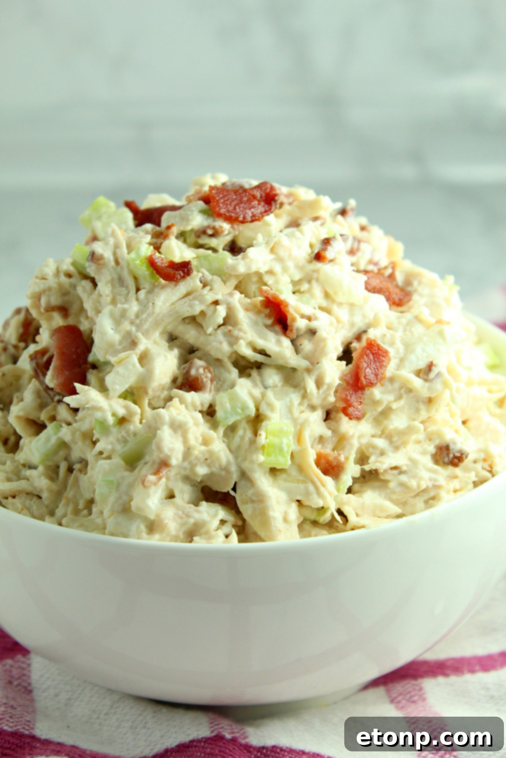 Freshly made Willow Tree Chicken Salad with bacon in a glass bowl.