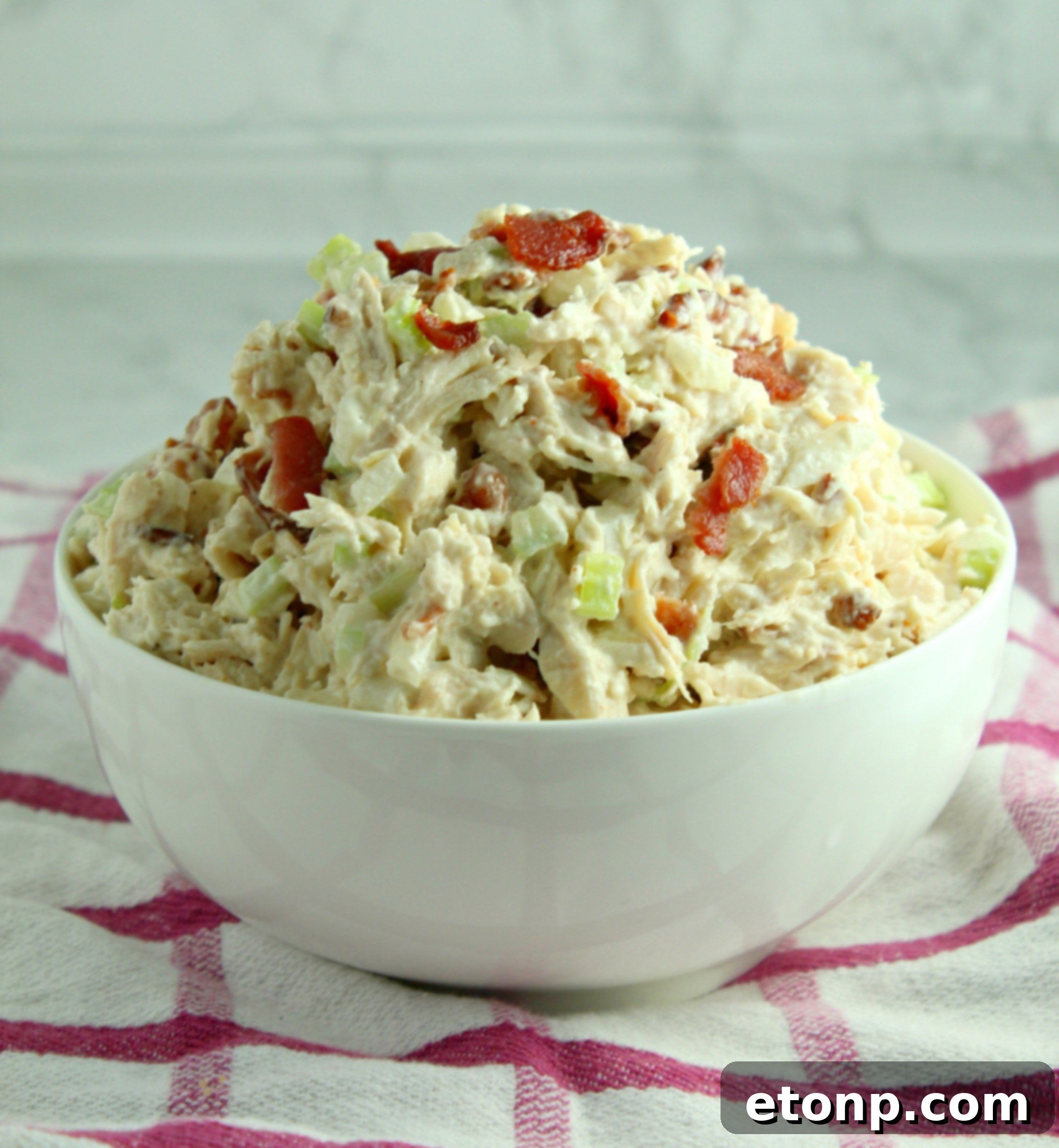 Willow Tree Chicken Salad with bacon, served with fresh herbs.