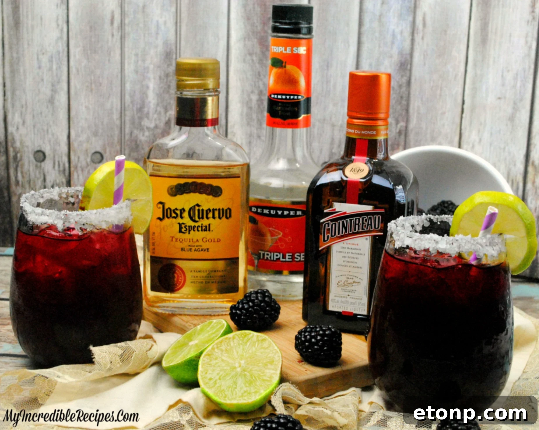 A close-up of a Blackberry Margarita with a sugared rim, garnished with fresh blackberries.