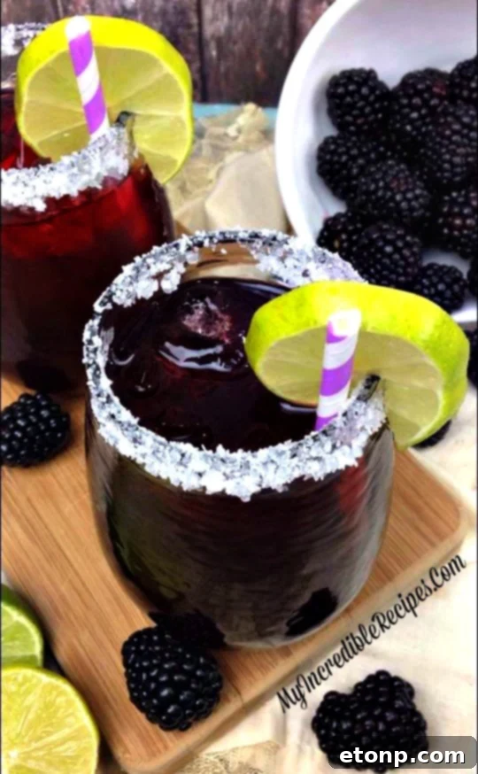 A blackberry margarita with a perfect blend of colors, indicating balanced sweetness.