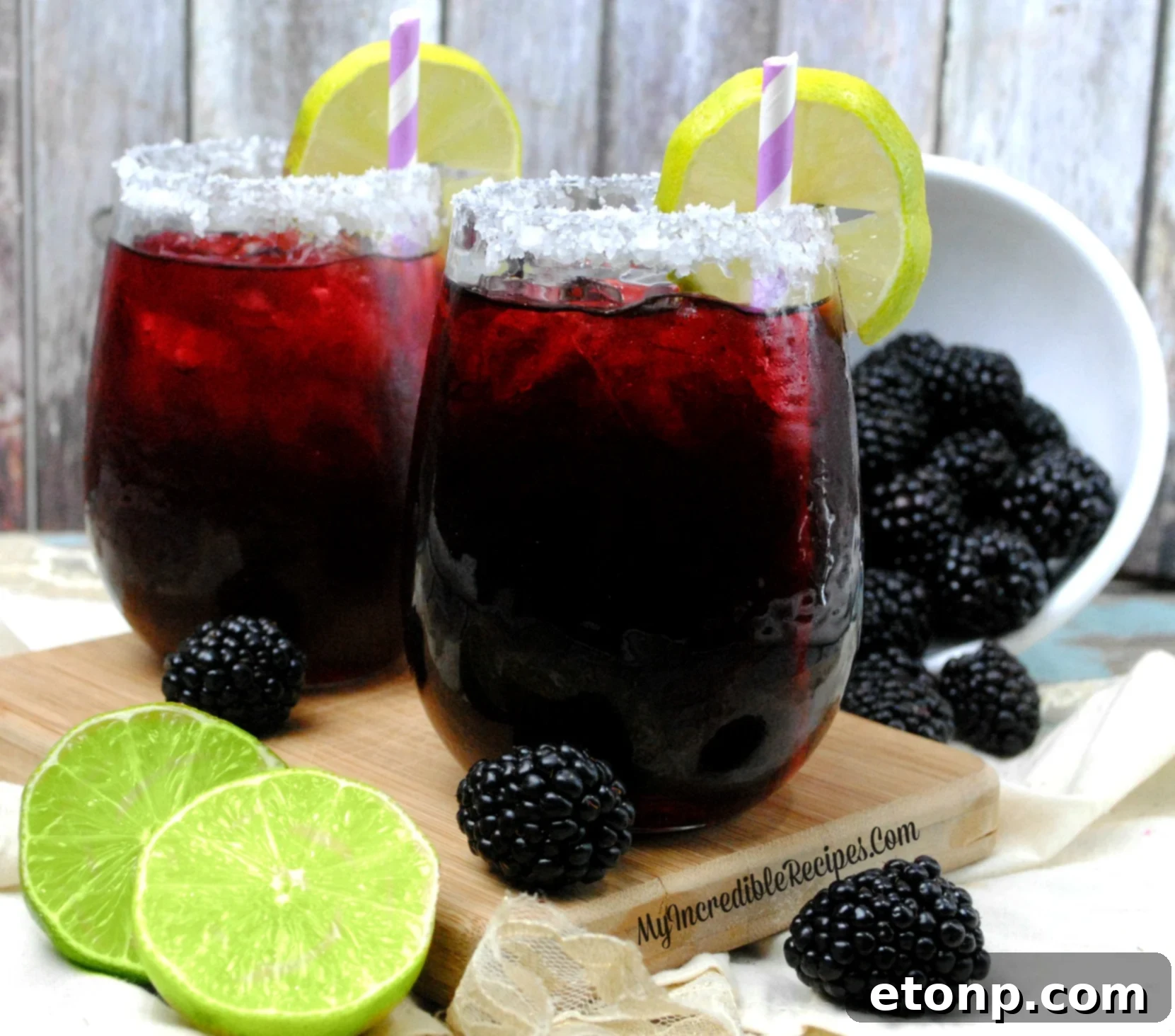 A full glass of Blackberry Margarita, ready to be enjoyed.