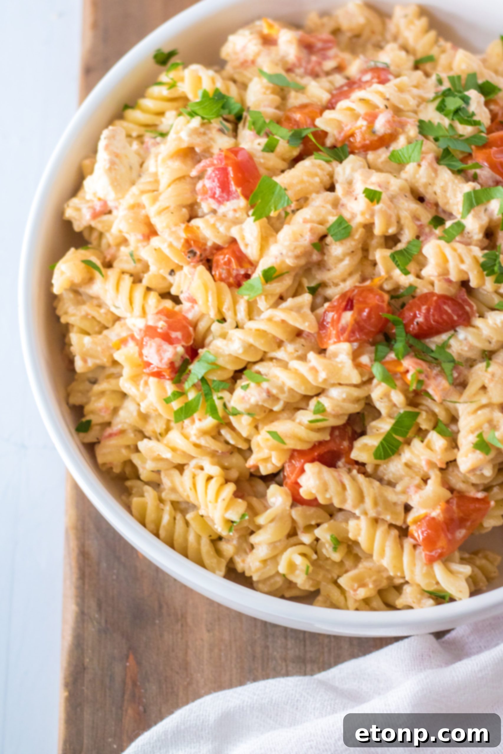 Plated Slow Cooker Tomato Feta Pasta with fork