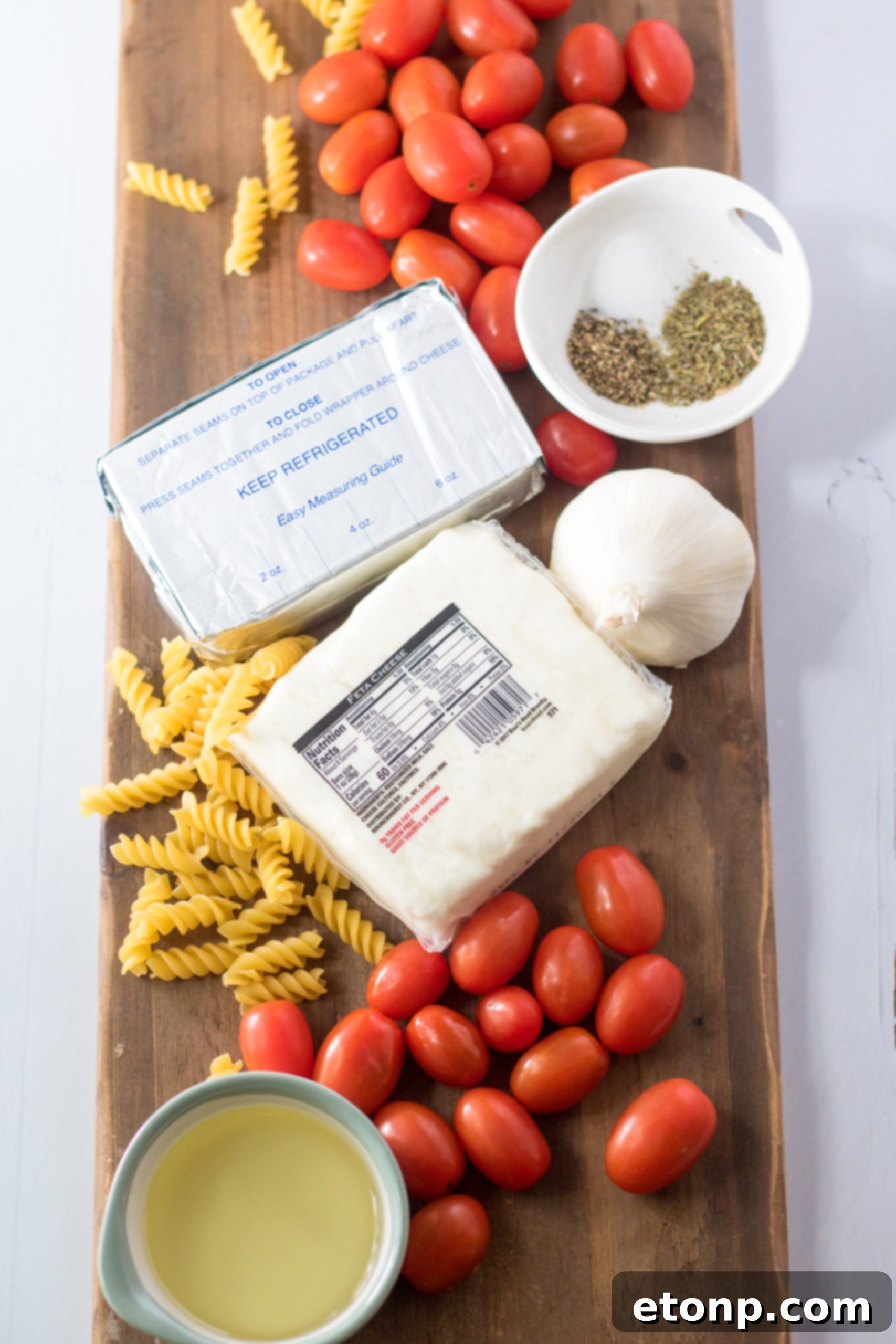 Close up of cooked Slow Cooker Tomato Feta Pasta with basil