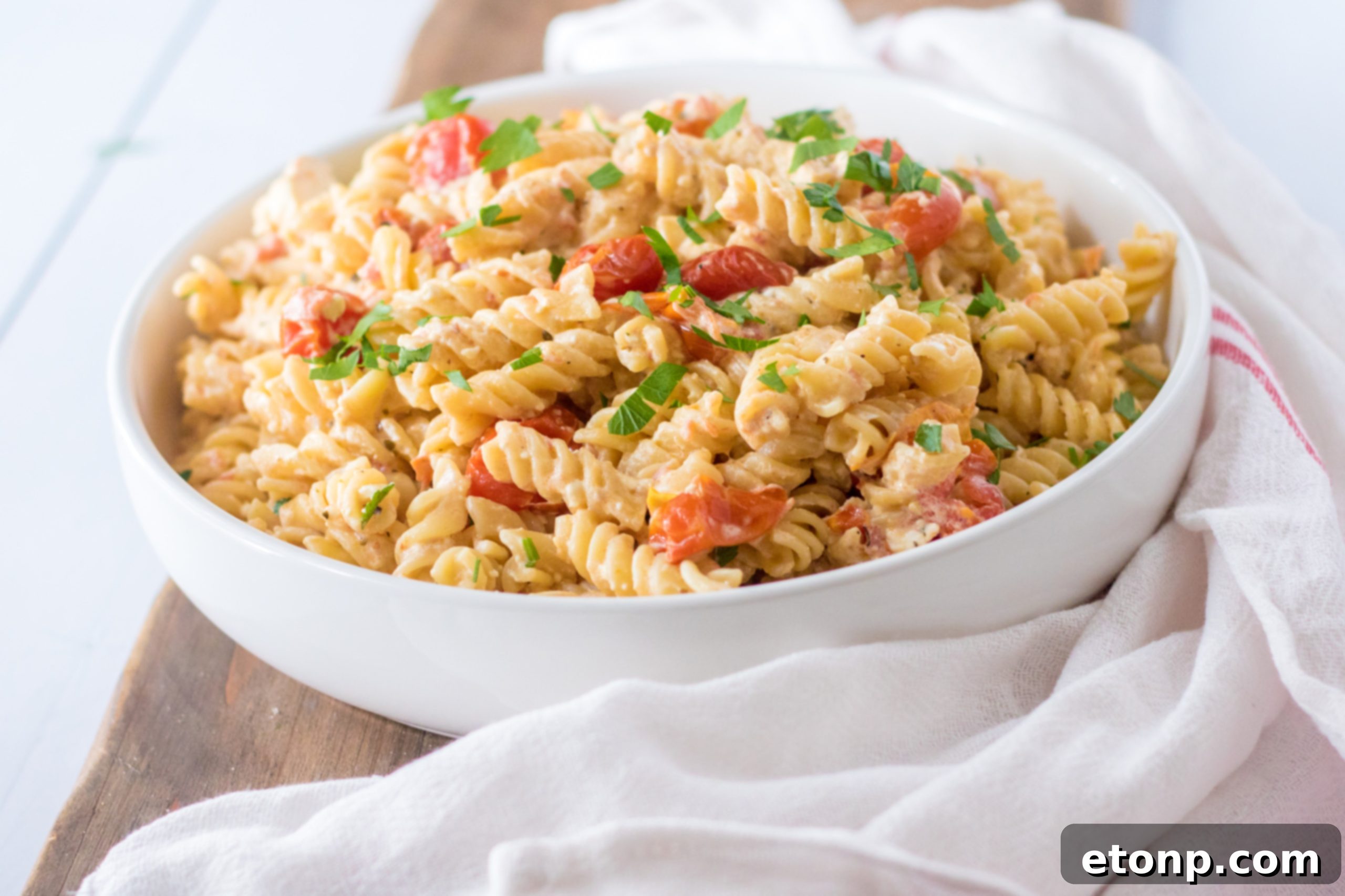 Cooked rotini pasta for Slow Cooker Tomato Feta Pasta