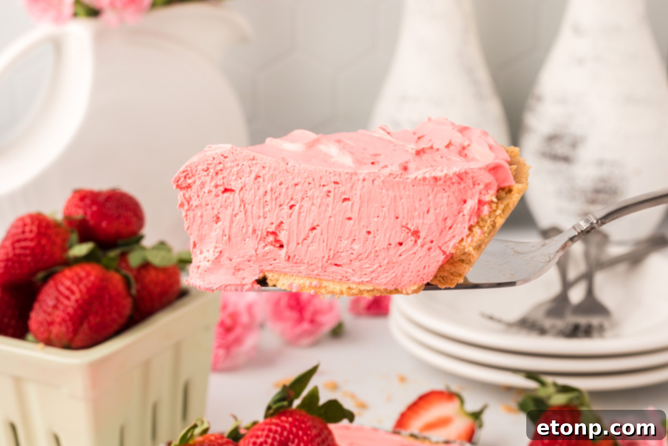 A final close-up image of a generous slice of Strawberry Kool-Aid pie, inviting viewers to take a bite, with its creamy filling and perfect crust visible.