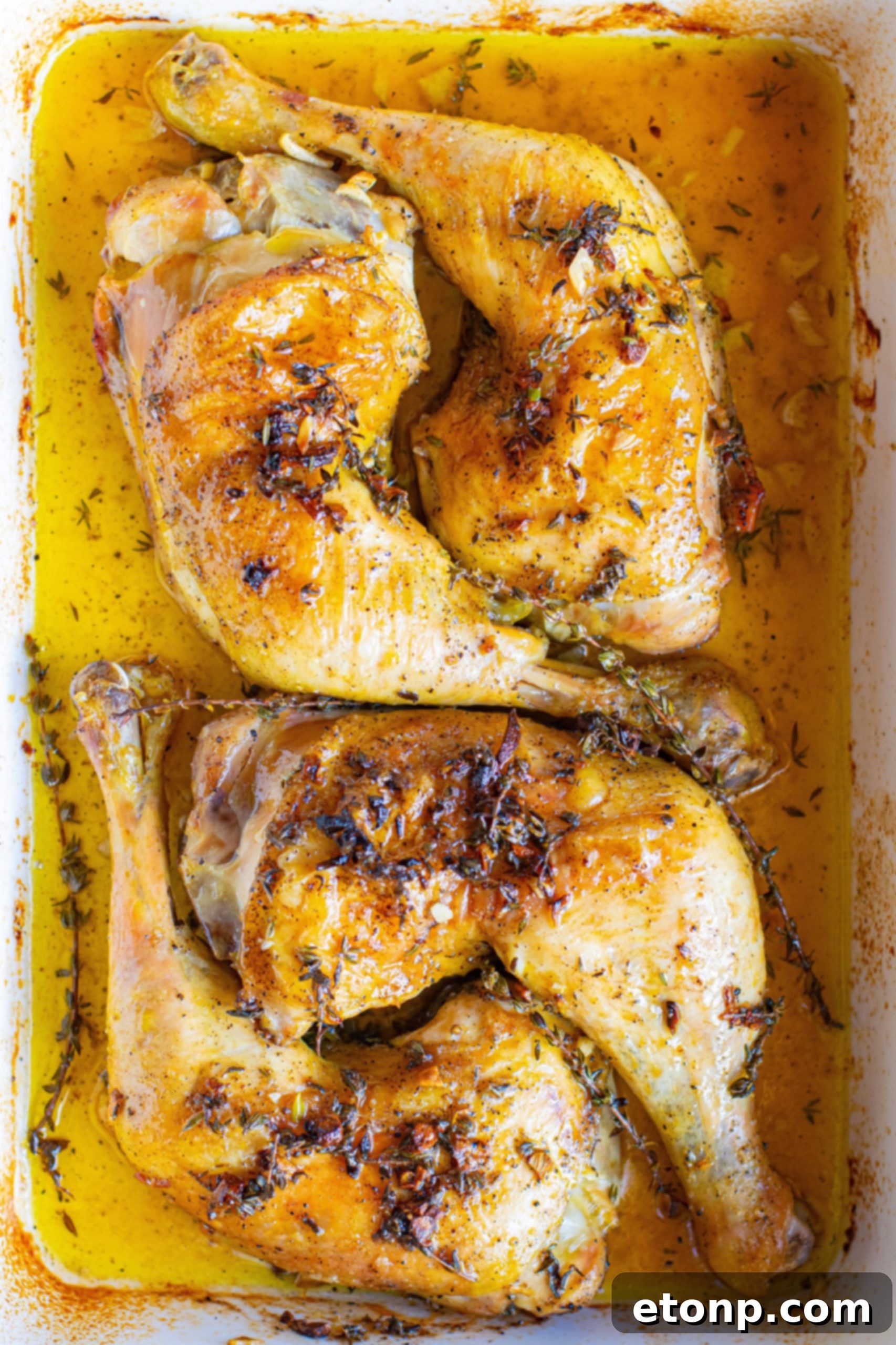 Golden Garlic Butter Roasted Chicken 5 Close-up of baked garlic butter chicken thigh