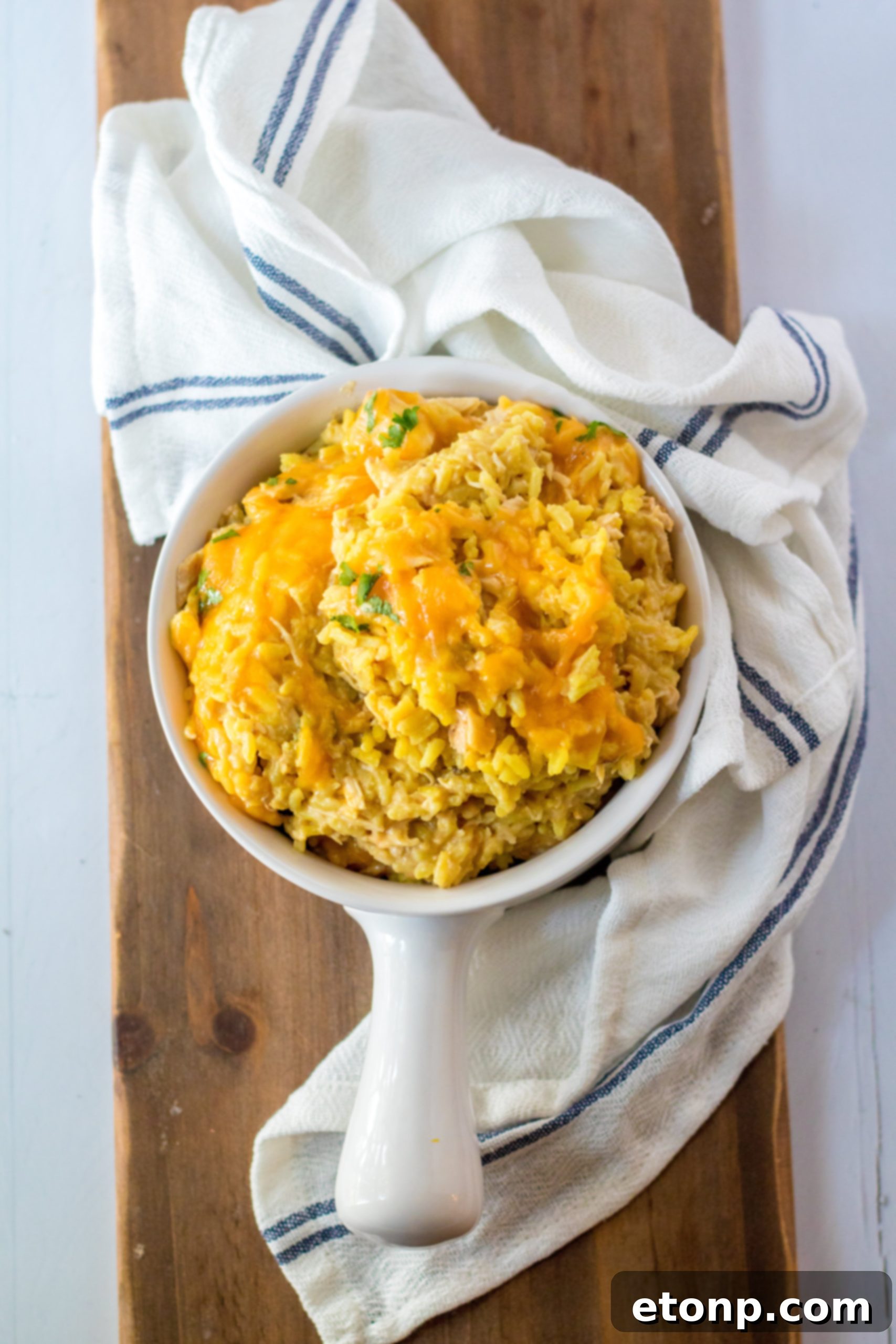 The final Slow Cooker Cheesy Chicken and Rice dish, topped with fresh herbs.