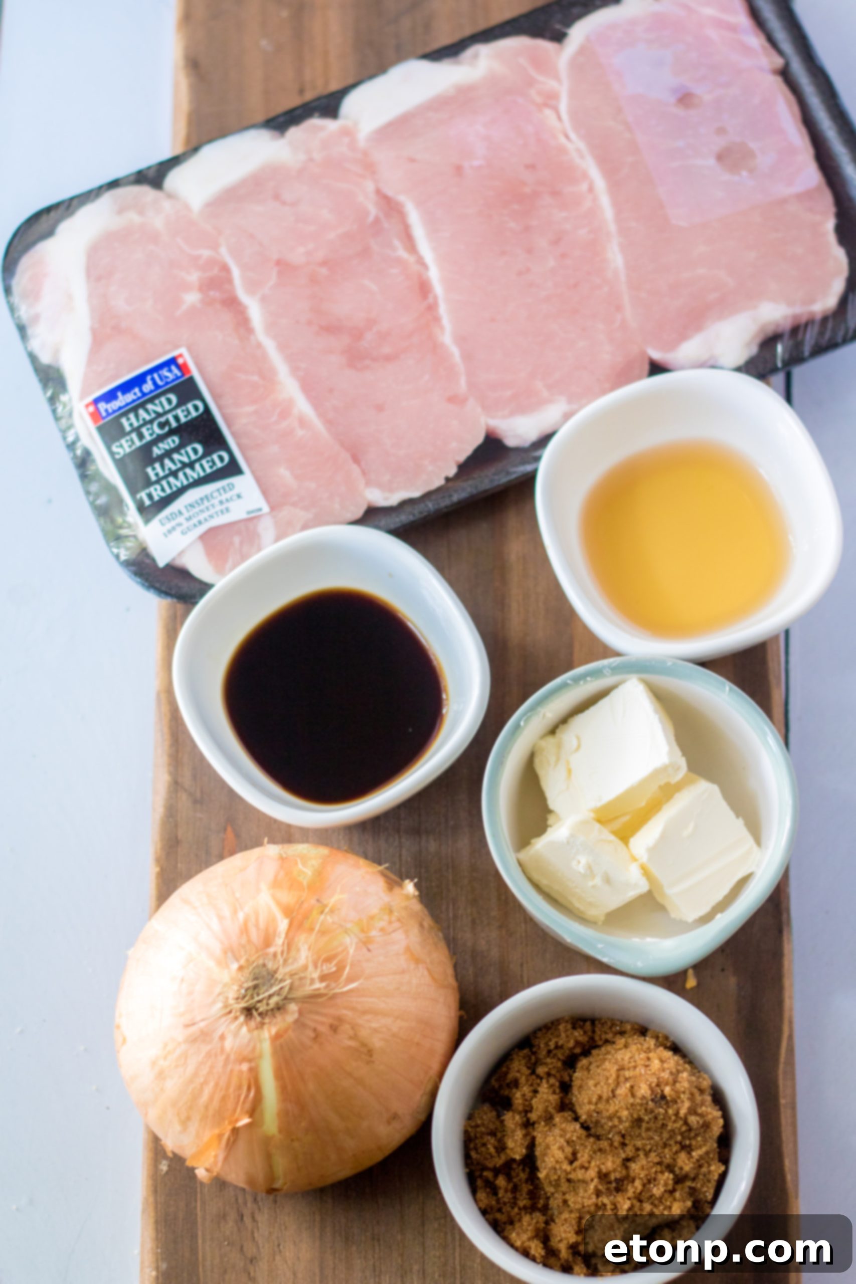 Tender Slow Cooker Pork Chops with Sweet Onions 3 Close up of slow cooker pork chops with onions