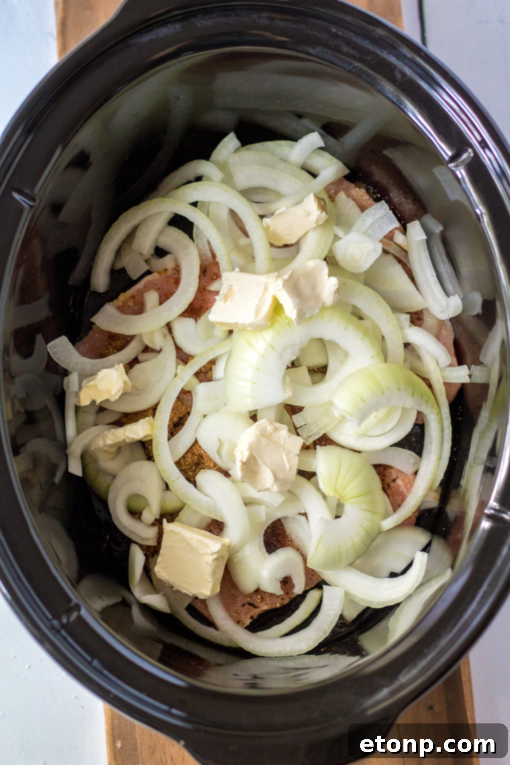Tender Slow Cooker Pork Chops with Sweet Onions 5 Slow cooker pork chops in the pot