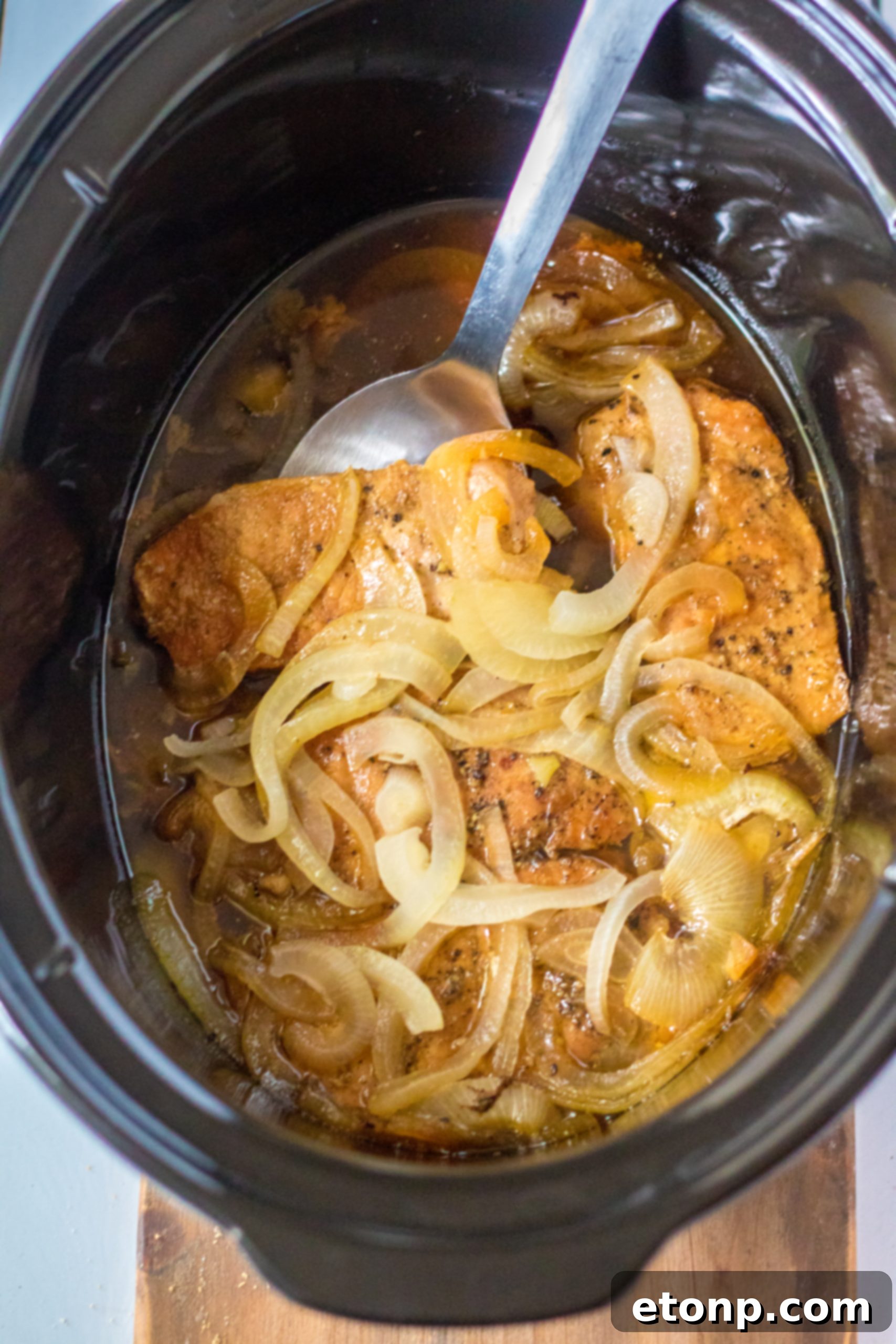Tender Slow Cooker Pork Chops with Sweet Onions 6 Ingredients for slow cooker pork chops and onions