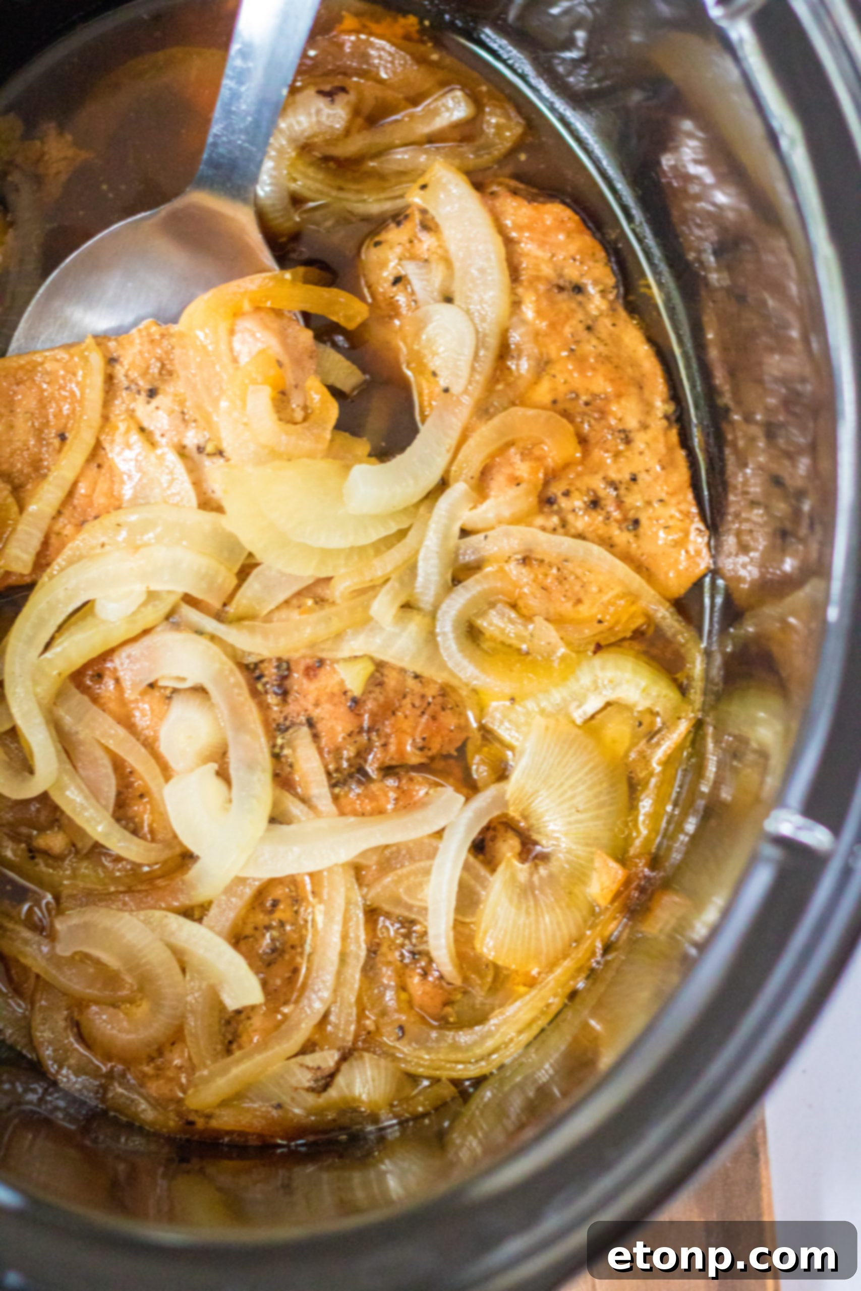 Tender Slow Cooker Pork Chops with Sweet Onions 7 Cooked slow cooker pork chops with onions