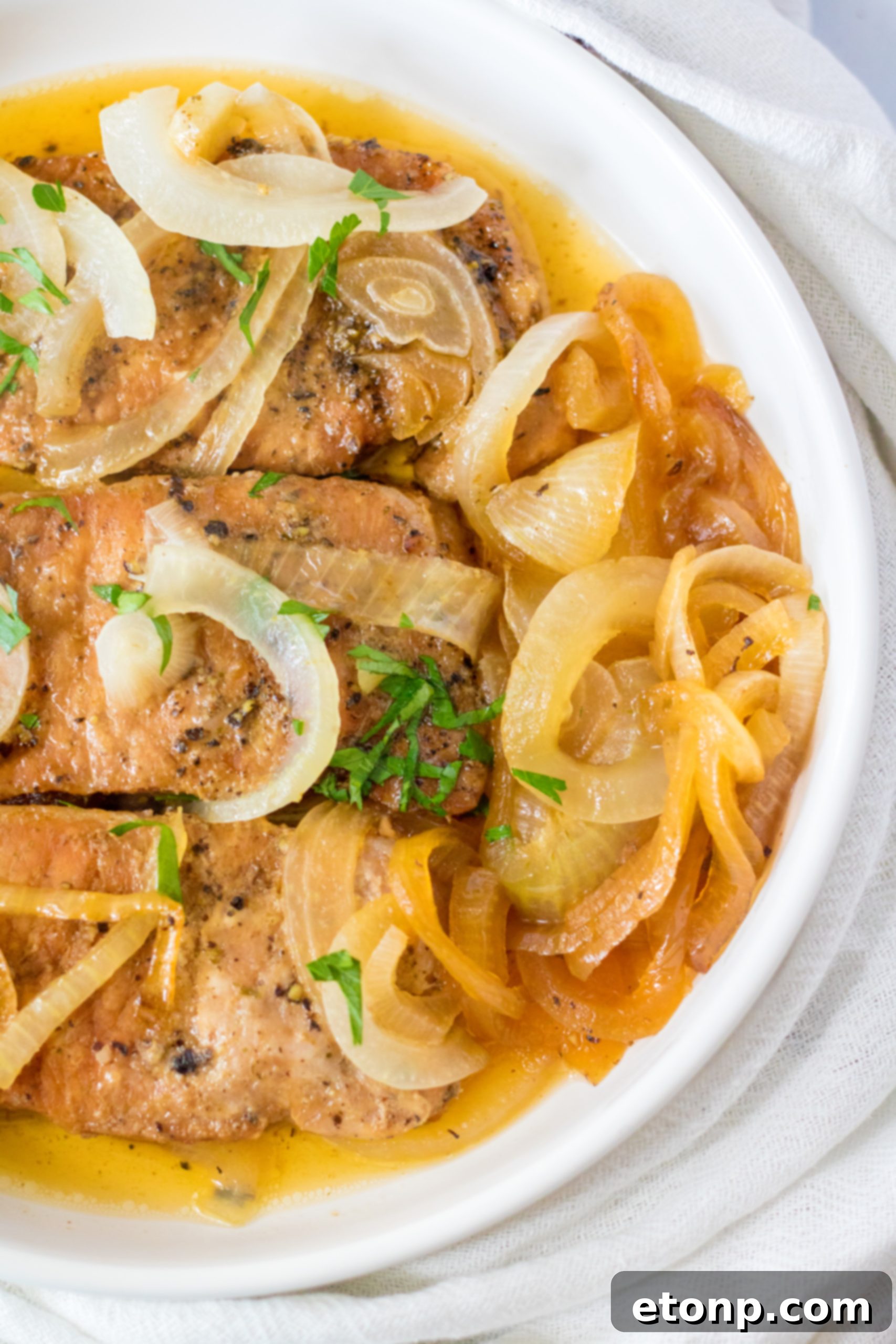 Tender Slow Cooker Pork Chops with Sweet Onions 8 Raw boneless pork chops ready for slow cooker
