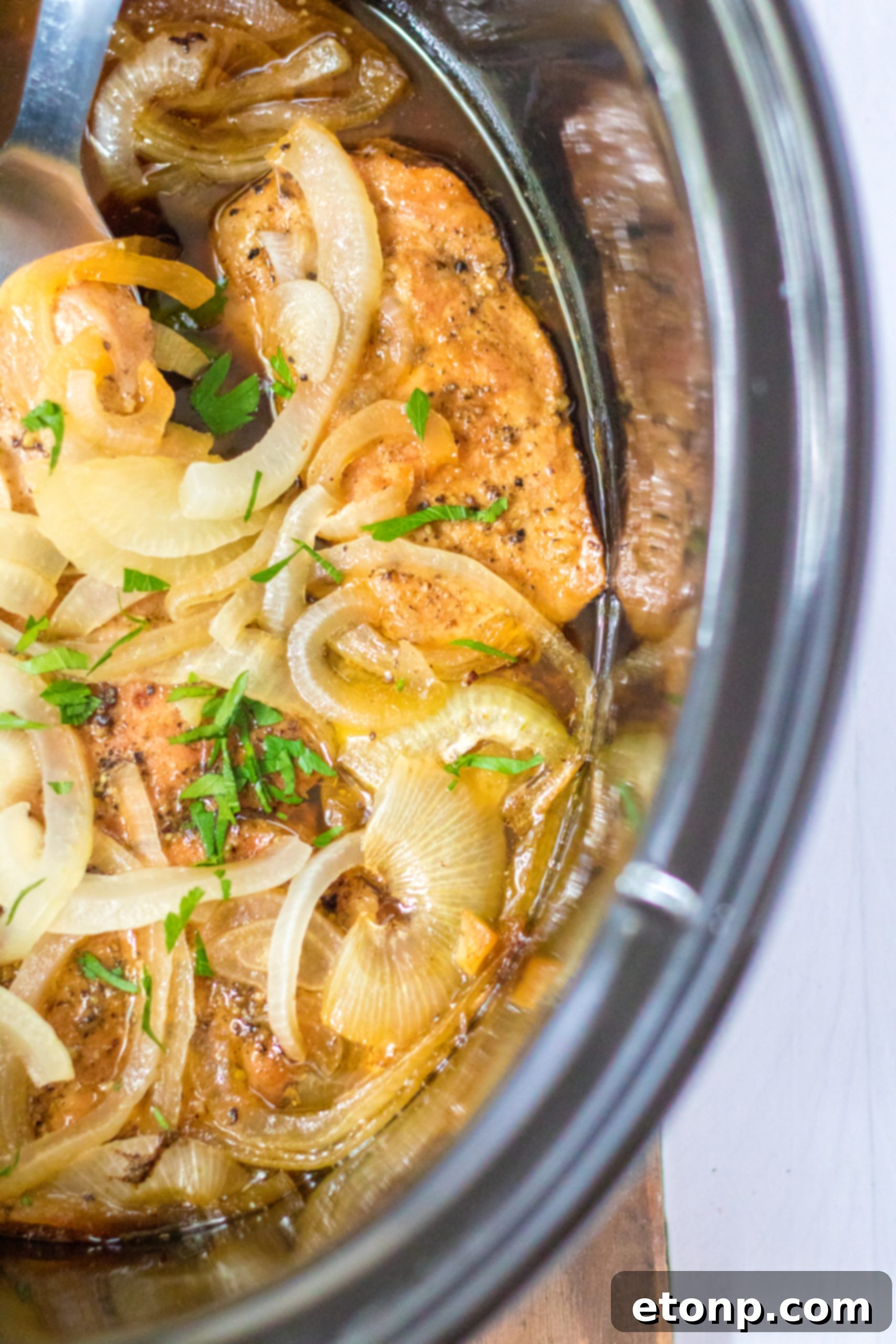 Tender Slow Cooker Pork Chops with Sweet Onions 9 Onions and butter ready for the slow cooker