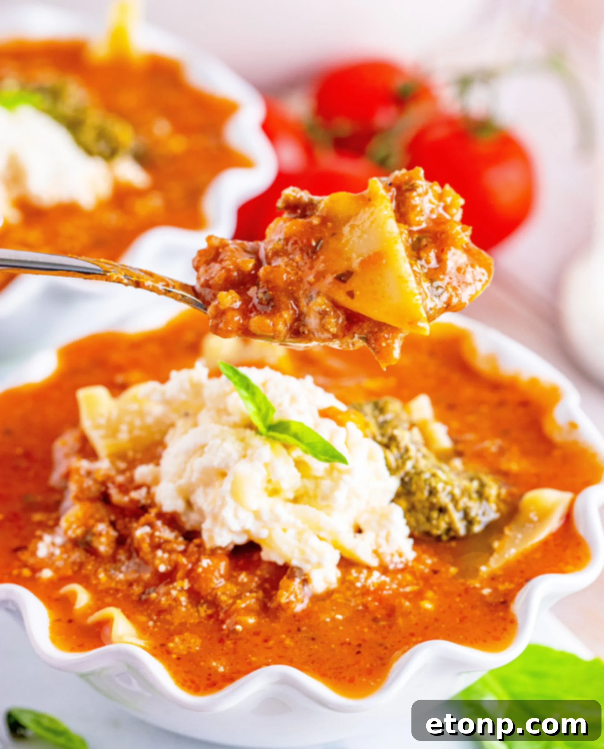 Lasagna Soup in a large pot on the stovetop, simmering gently.