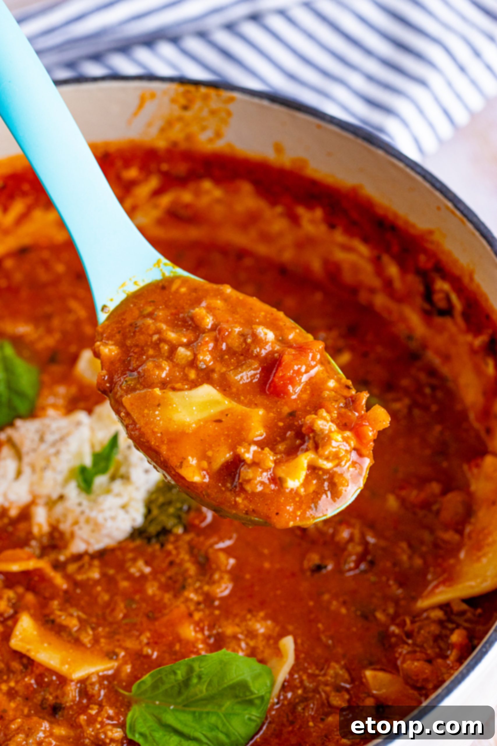 A close-up of the simmering Lasagna Soup, showing the rich texture of the sauce.