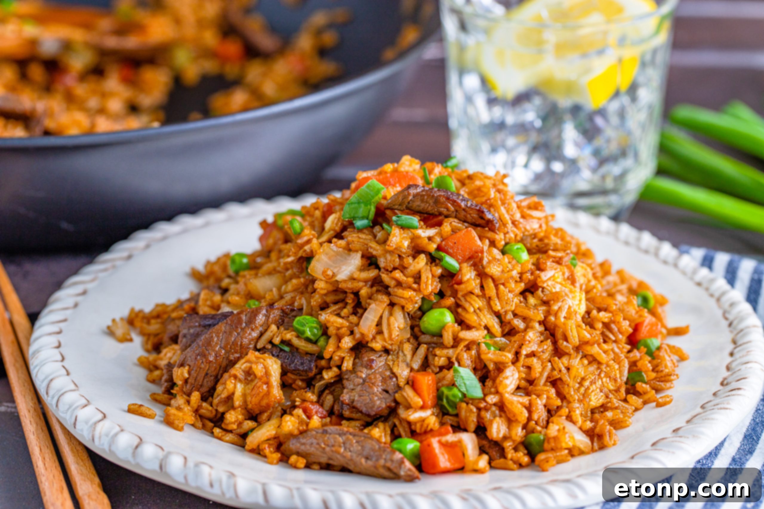 A large pan filled with freshly cooked Beef Fried Rice