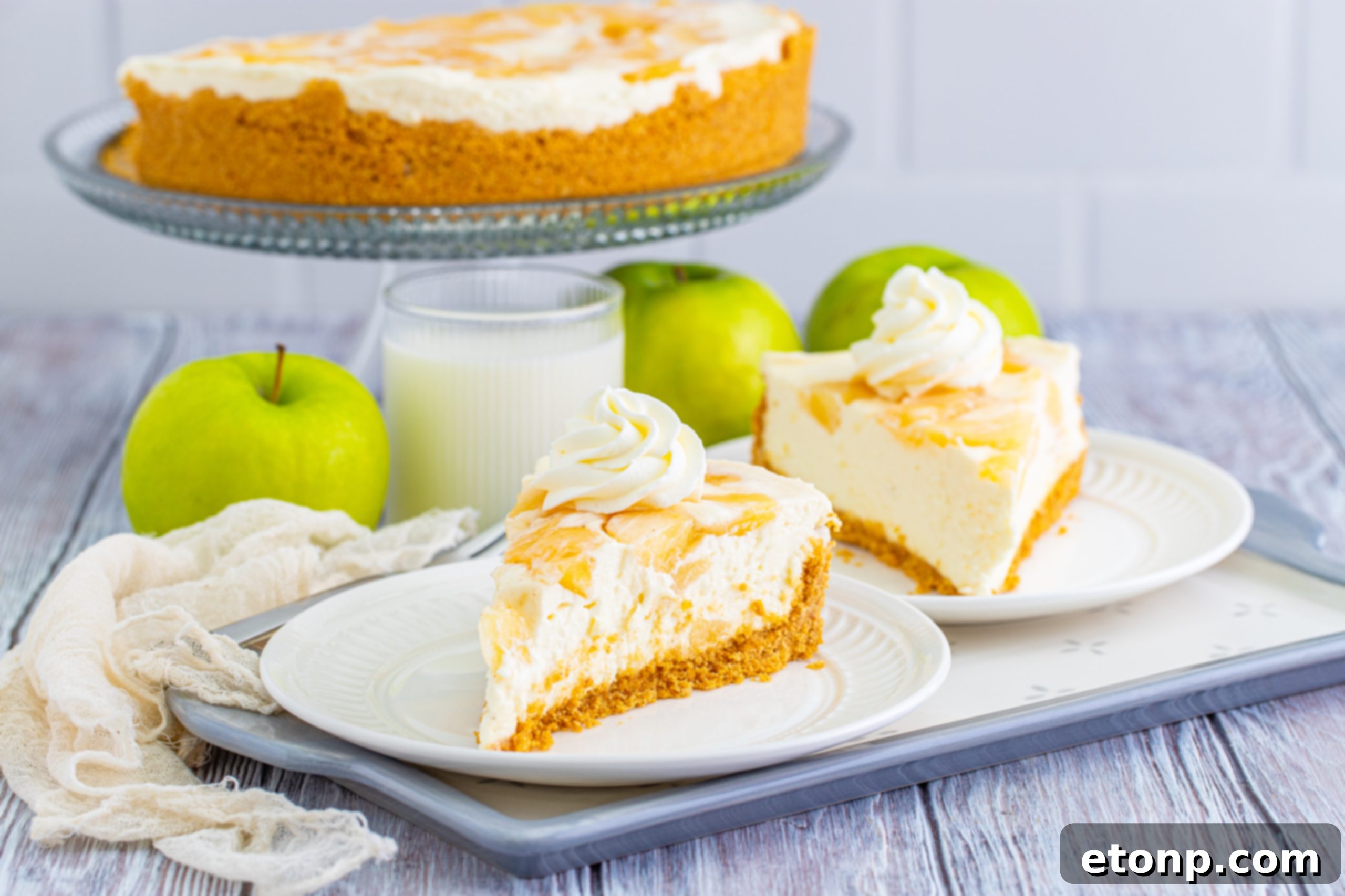 An overhead shot of a No Bake Apple Cheesecake, garnished with a sprinkle of cinnamon, ready to be served.