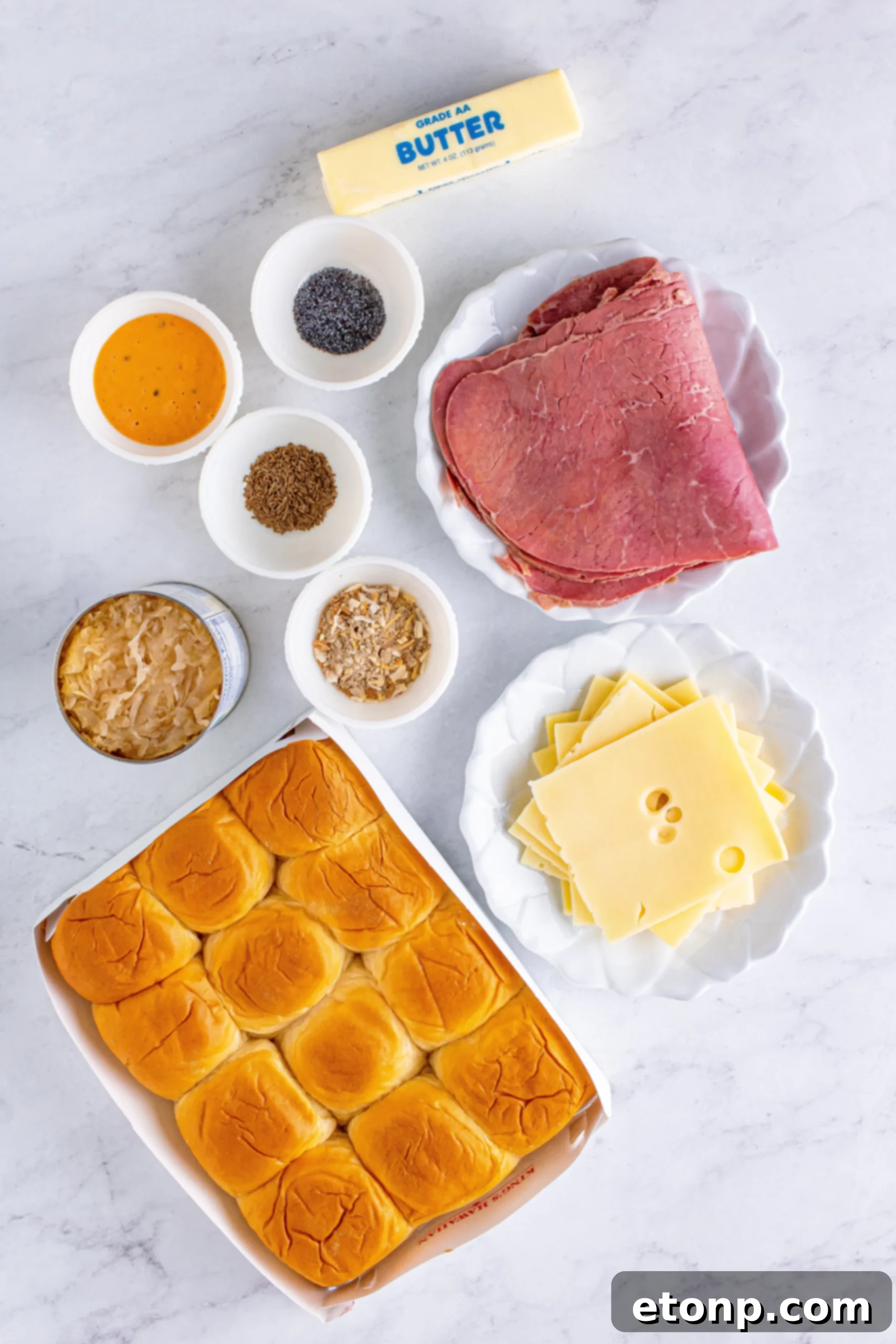 Mini Reuben Sandwiches 3 Reuben Sliders arranged on a serving platter, showing the individual slider buns with filling.
