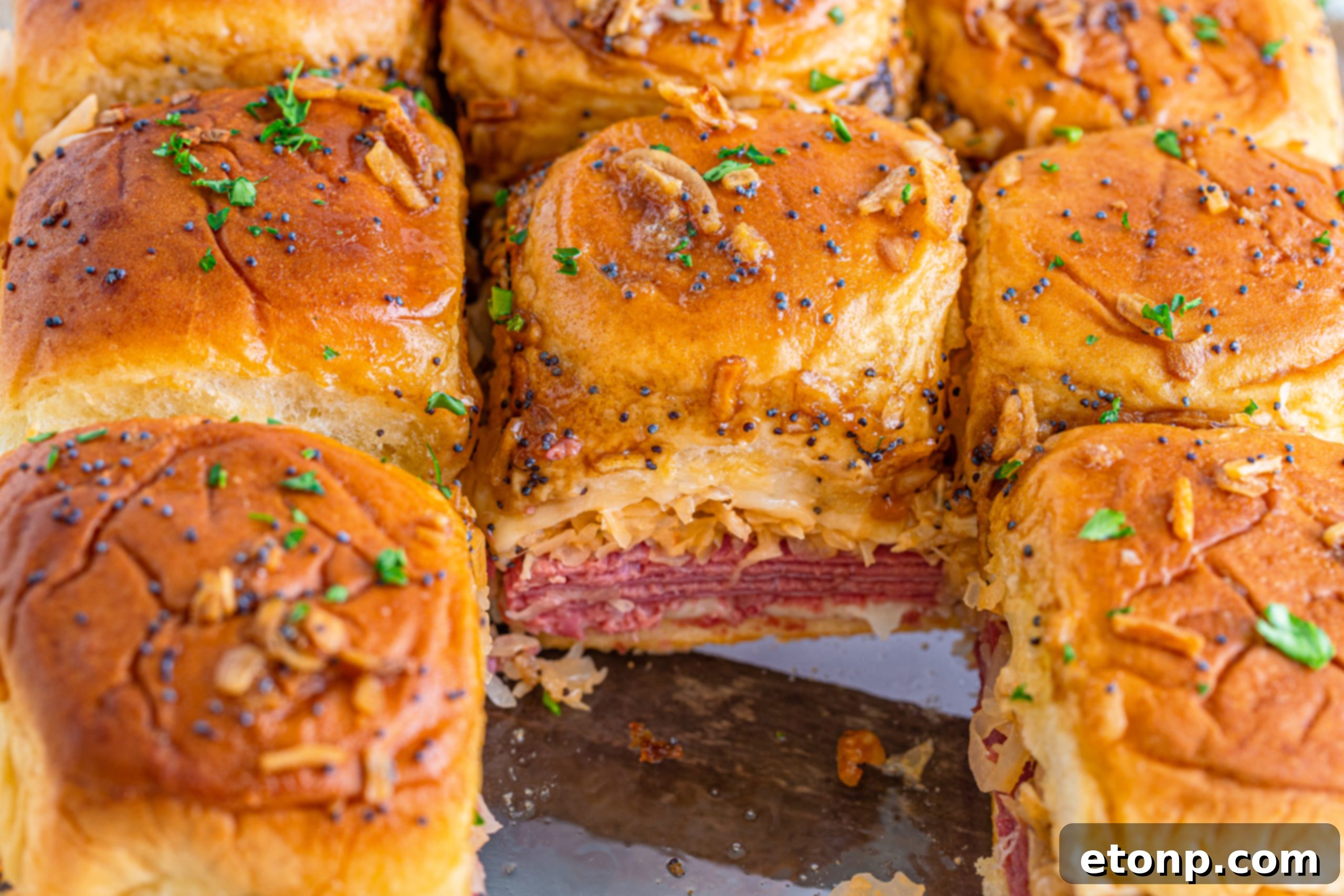 Mini Reuben Sandwiches 4 Overhead shot of a tray of freshly baked Reuben Sliders, ready to be served.