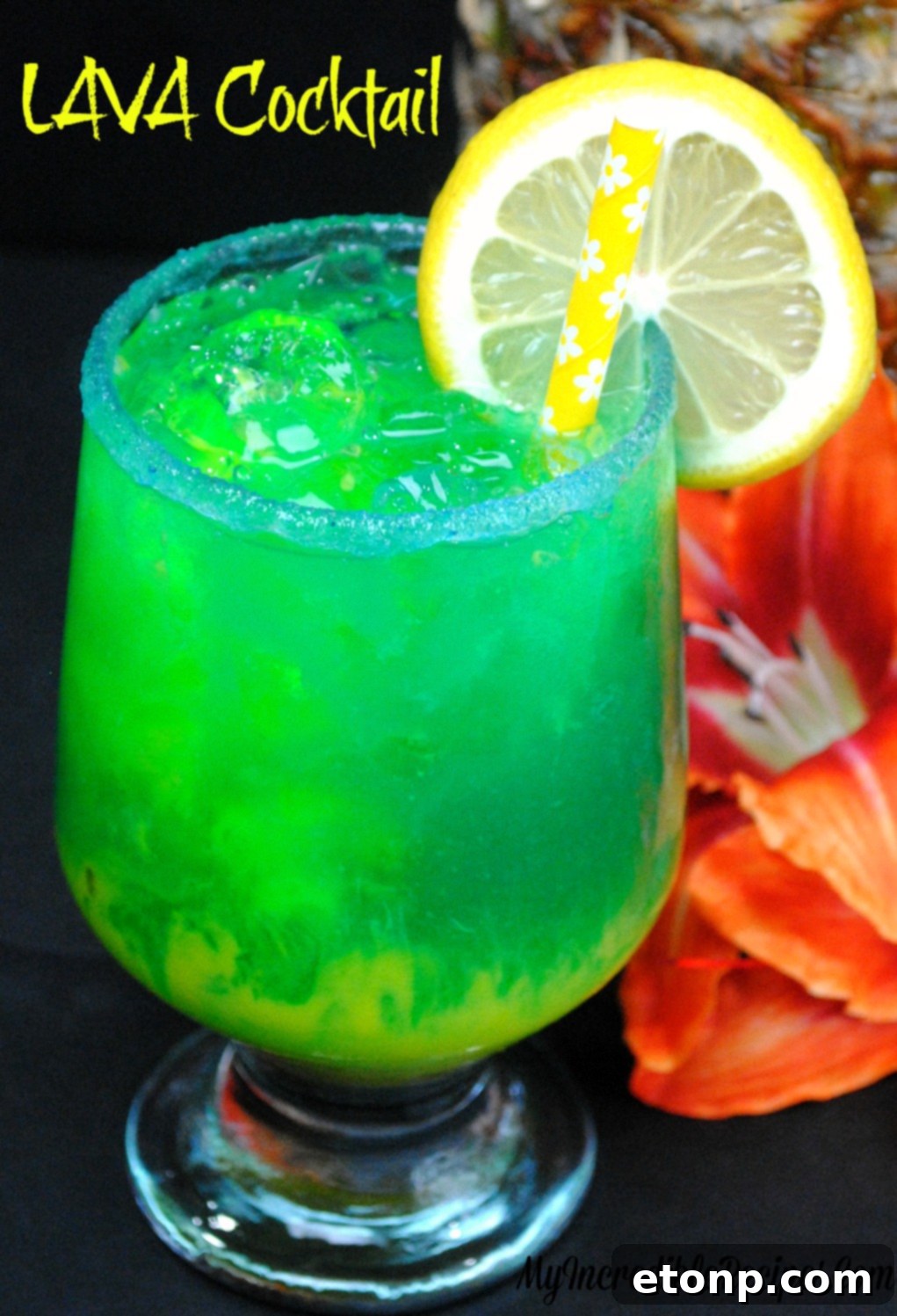 Lava Cocktail main image, vibrant blue and orange layers in a tall glass with sugared rim and lemon garnish