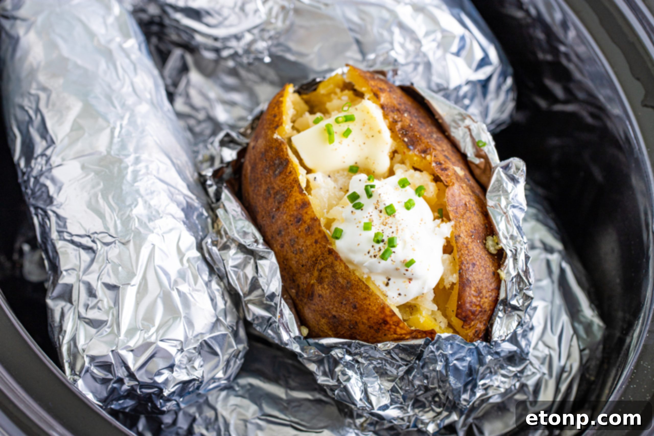 Various toppings for baked potatoes in small bowls
