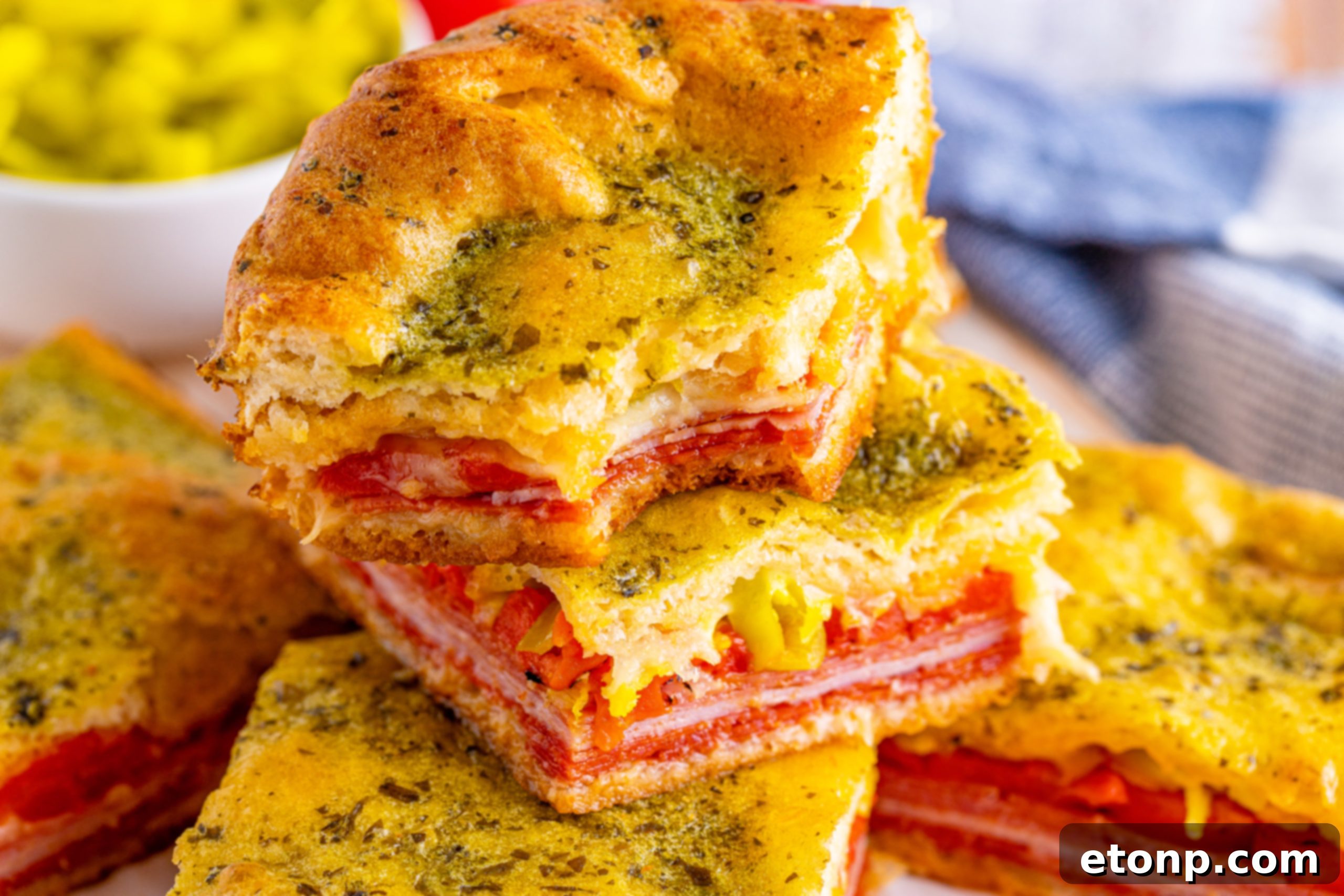 Italian Antipasto Squares neatly wrapped in foil, ready for freezing.
